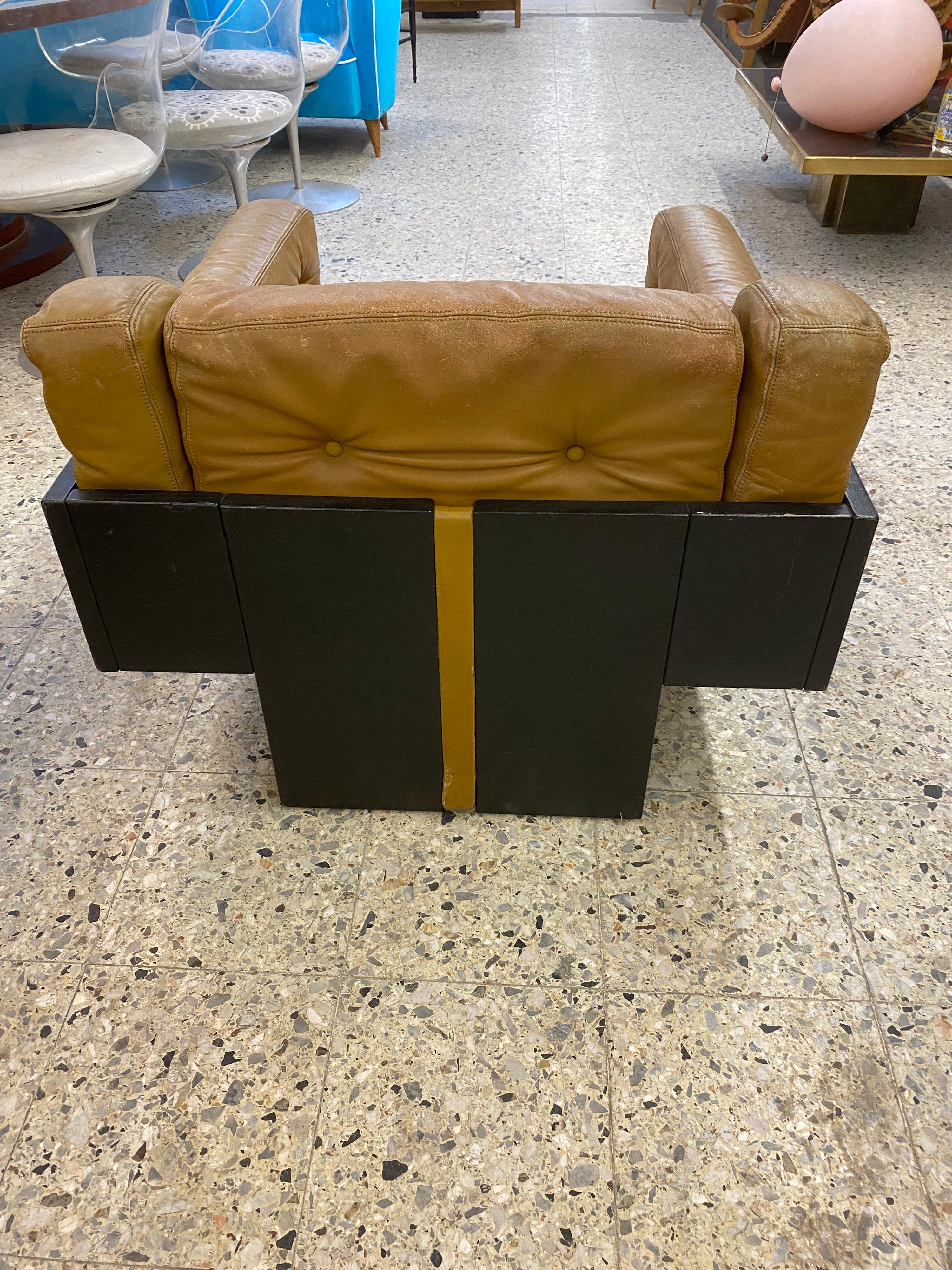 Italian In the style of Claudio Salocchi, Armchair in lacquered wood and leather For Sale