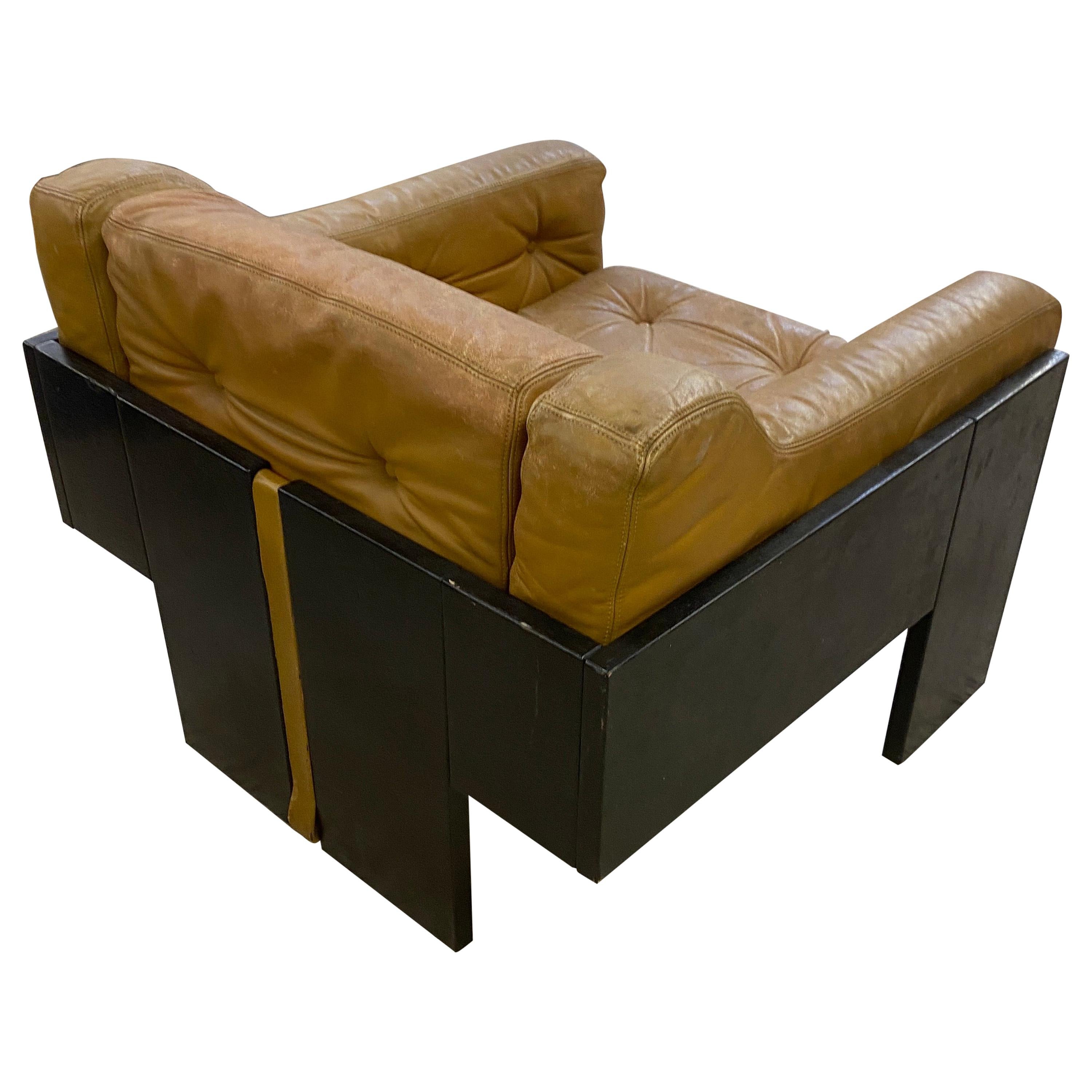 In the style of Claudio Salocchi, Armchair in lacquered wood and leather For Sale