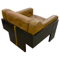 In the style of Claudio Salocchi, Armchair in lacquered wood and leather