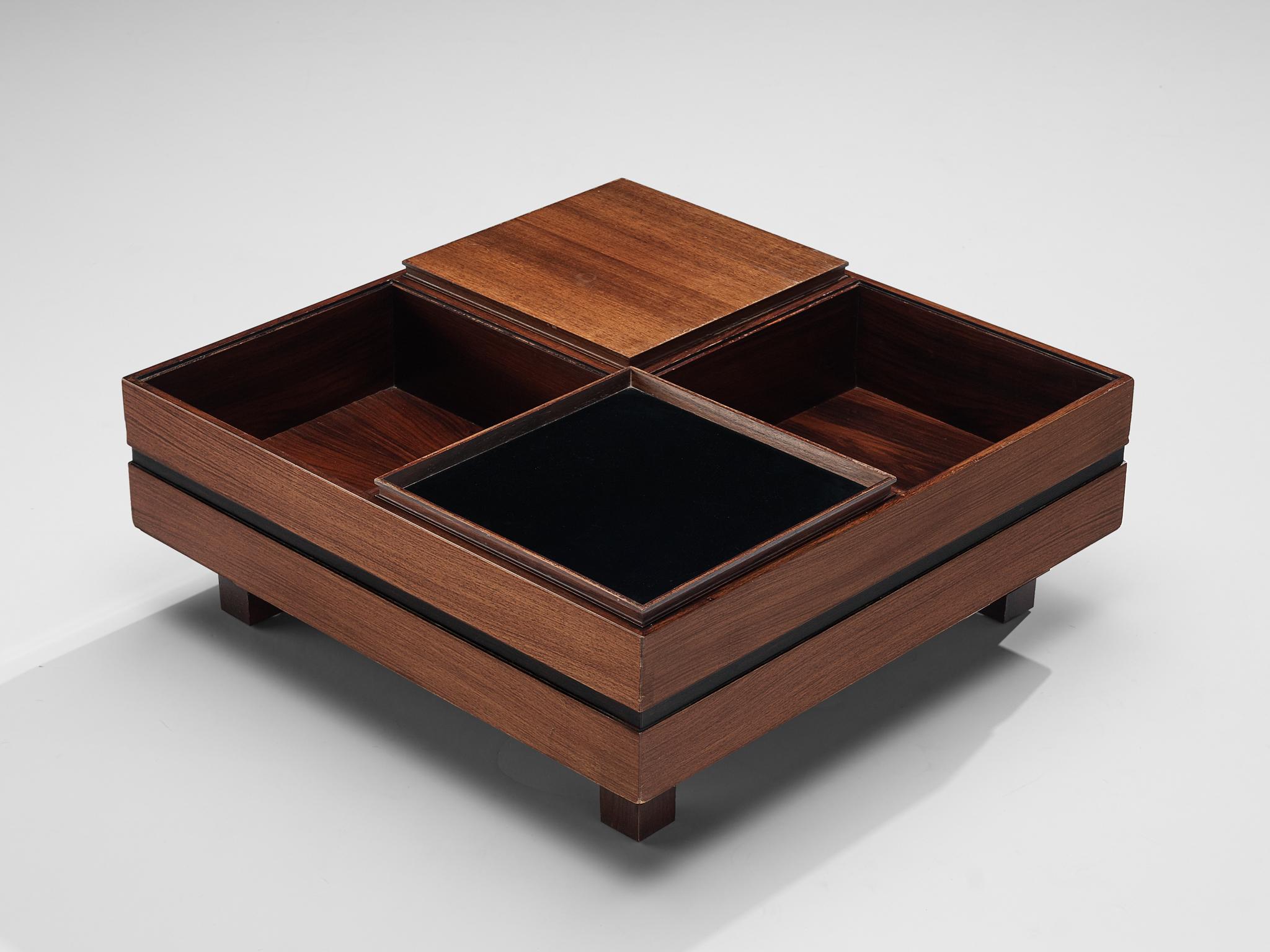Claudio Salocchi, coffee table, rosewood, walnut, Italy, 1960s.

Italian designer Claudio Salocchi provides a clearly structured coffee table with a strong visual effect and a combination of walnut and rosewood. On low height the quadratic side