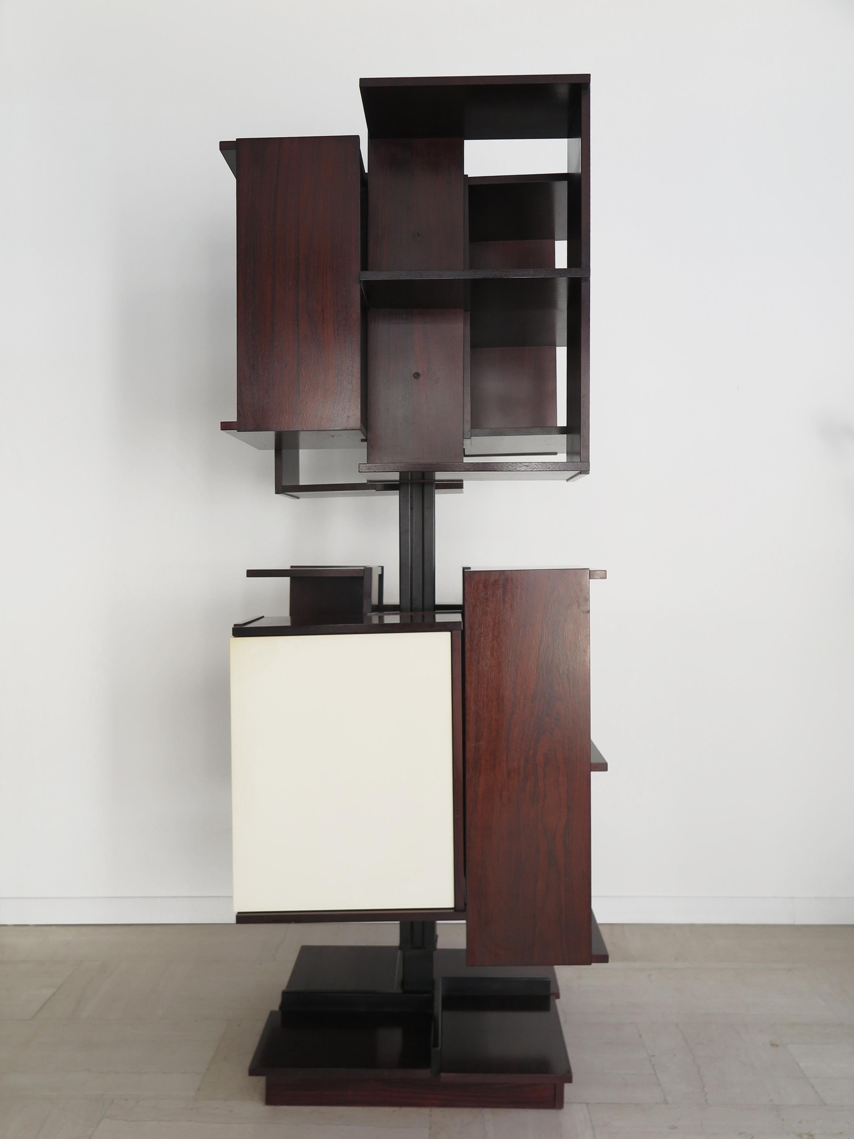 Italian Mid-Century Modern design revolving bookcase model “Centro” designed by Claudio Salocchi (Milano 1934 - Milano 2012) and produced by Sormani Arosio with central revolving structure in black enameled metal and wooden storage units, one of