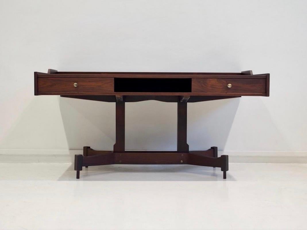 Hardwood writing desk designed by Claudio Salocchi and manufactured by Sormani. Featuring a central leg with four bentwood and solid wood feet. Tabletop with two drawers and a shelf underneath.