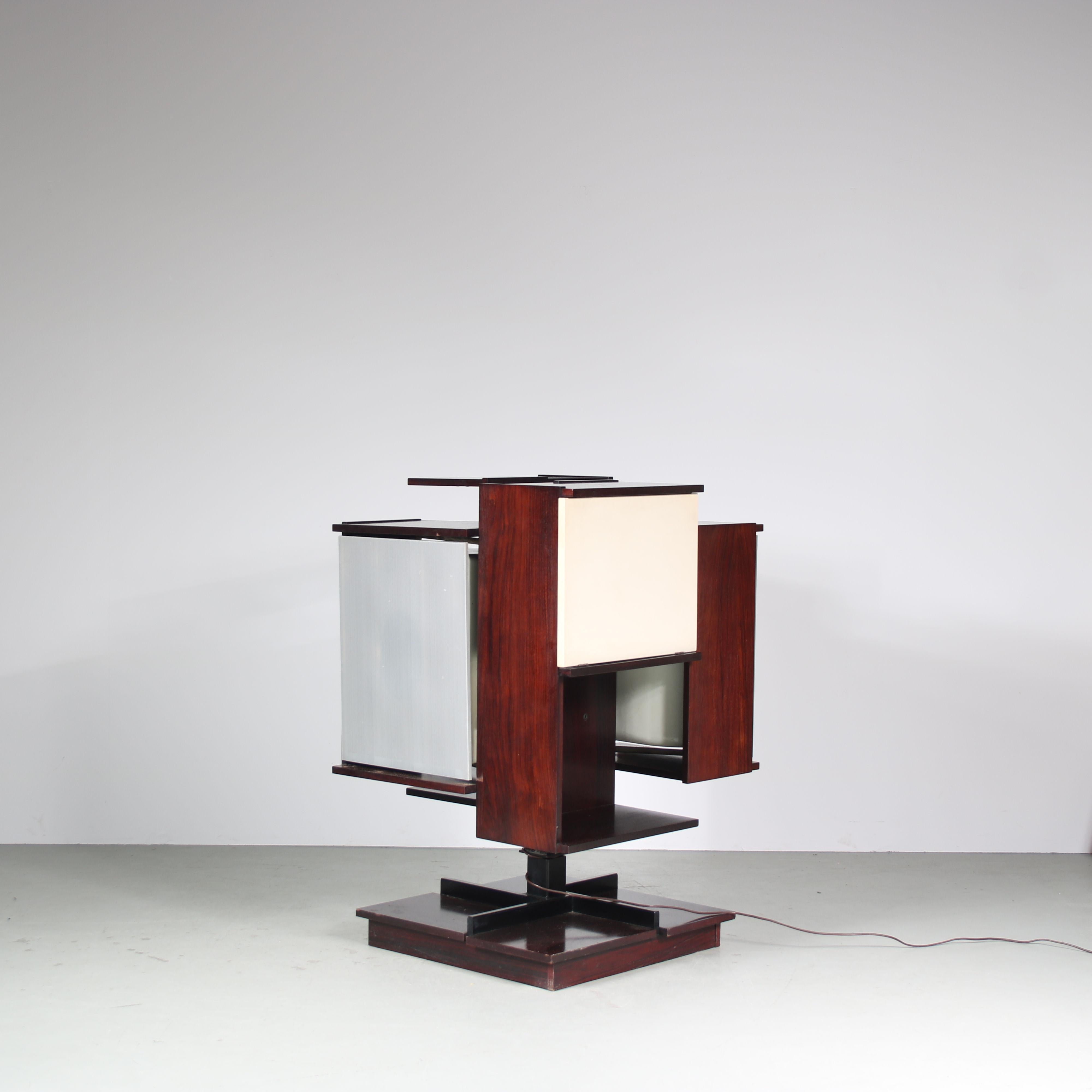 A fantastic HiFi cabinet designed by Claudio Salocchi, manufactured by Sormani in Italy around 1960.

This beautiful and rare piece is made of high quality rosewood with one door being white laminated. It  stands on a swivel base and the doors