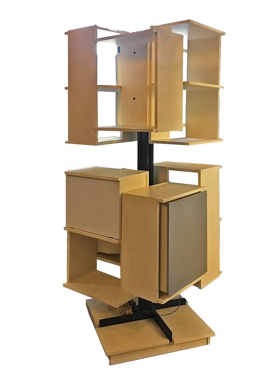 High revolving bookcase in lacquered wood, rare model made for a customer, with acoustic and stereo system, the speakers can be steered, with eight open storage compartments: four in height 80 cm x width 46 x depth 28.5, with one shelf each, four in