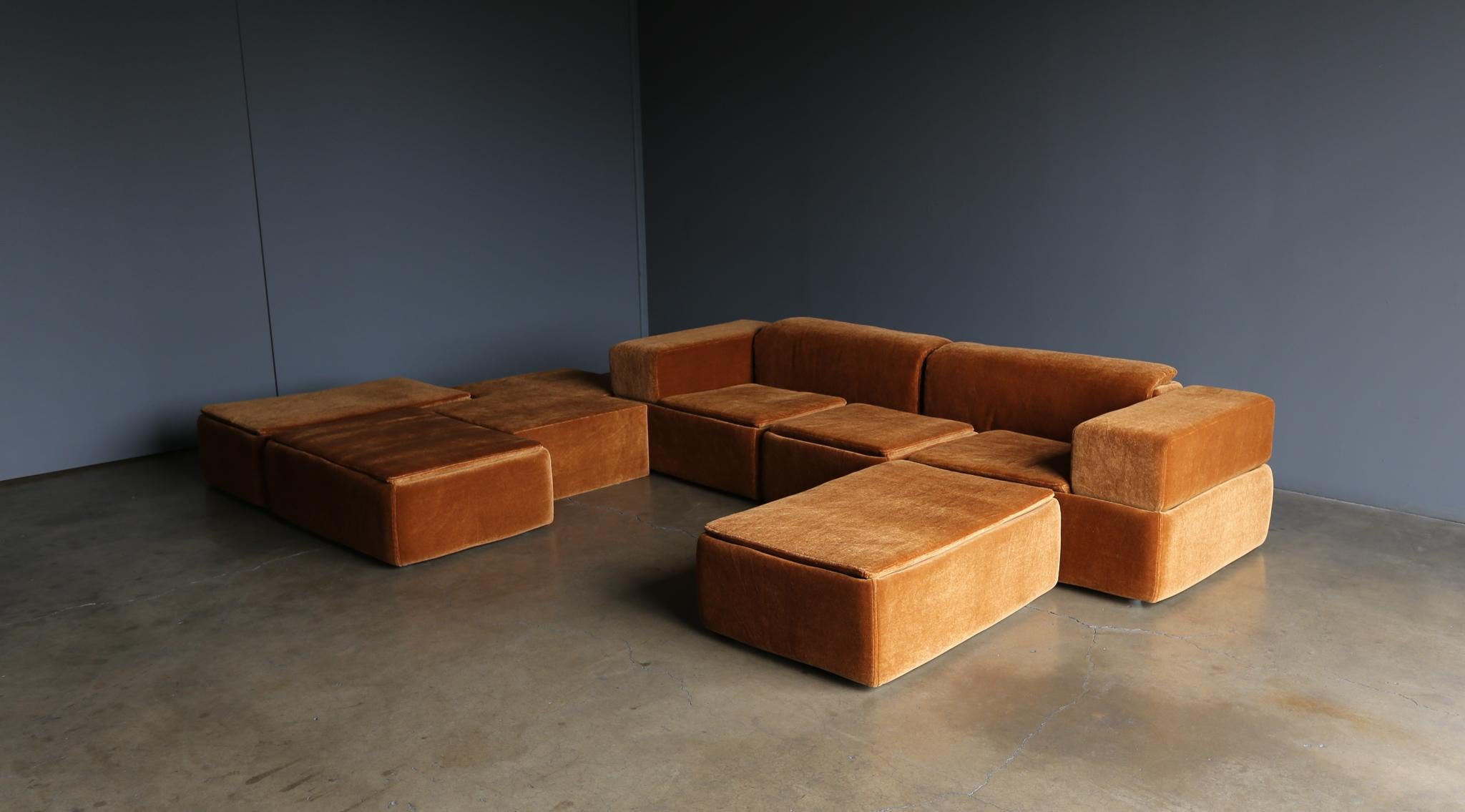 Claudio Salocchi Paione Modular Mohair sofa for Sormani, circa 1968. This sofa has been professionally restored. 

This modular sofa set is comprised of seven pieces. 

Three ottomans measure: 42