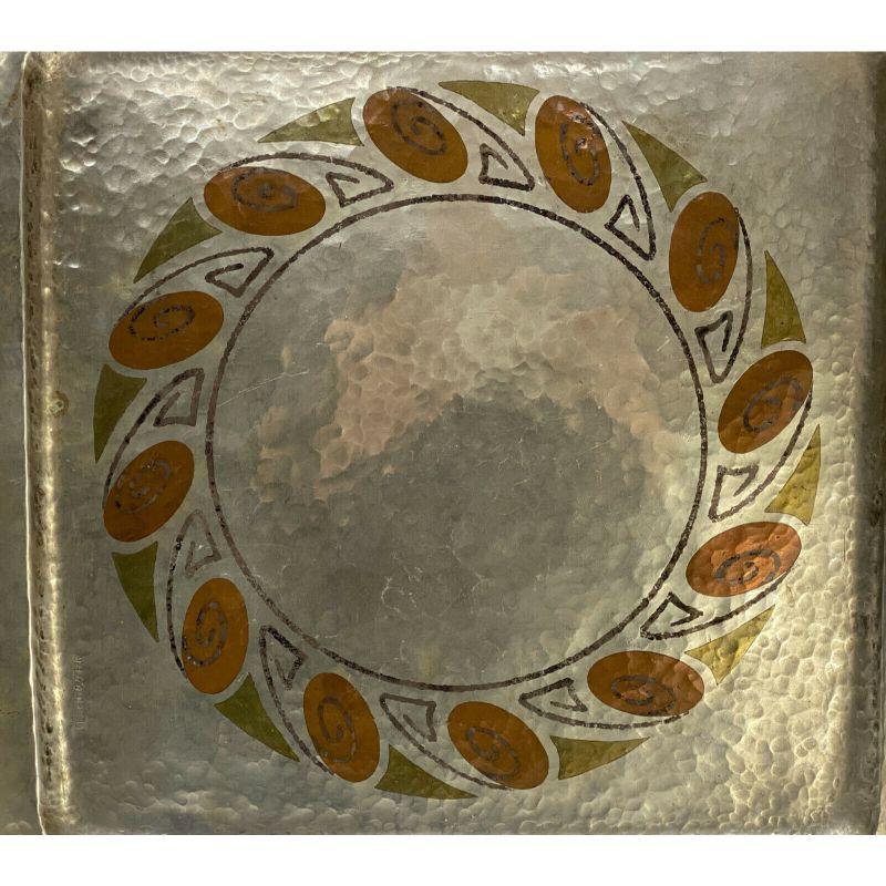 Claudius Linossier Silver Mixed Metal Inlay tray, circa 1930

Claudius Linossier (French 1893-1953) silver mixed metal inlay hand hammered dinanderie dish tray, circa 1930. Mixed metal inlay wreath to the central area. Signed 
