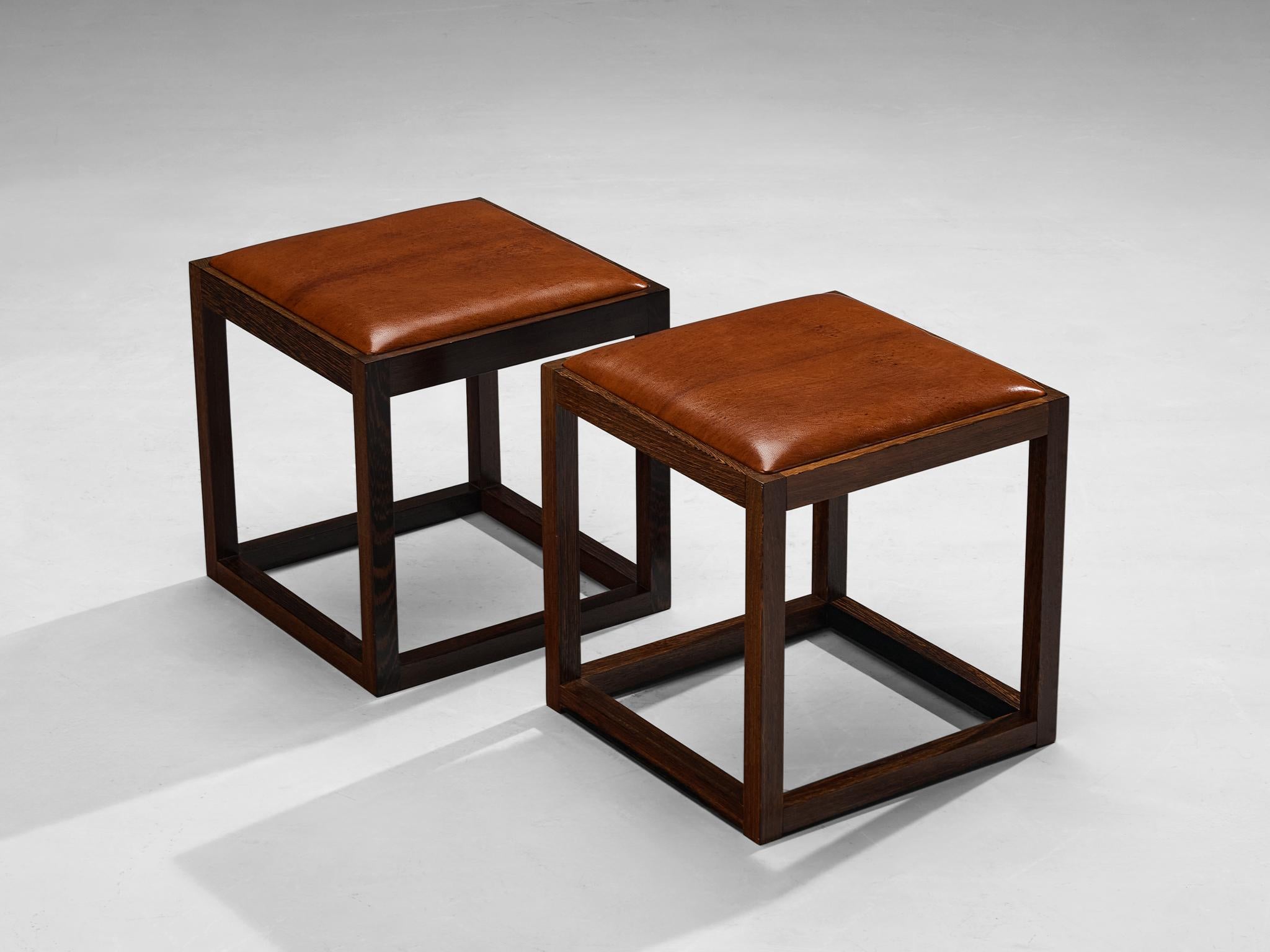 Claus Bonderup & Torsten Thorup, stools, wengé, leather, Denmark, 1960s/1970s

Presenting an exquisite set of four wengé stools, designed by design duo Claus Bonderup and Torsten Thorup. These stools were meticulously crafted in the late 1960s to