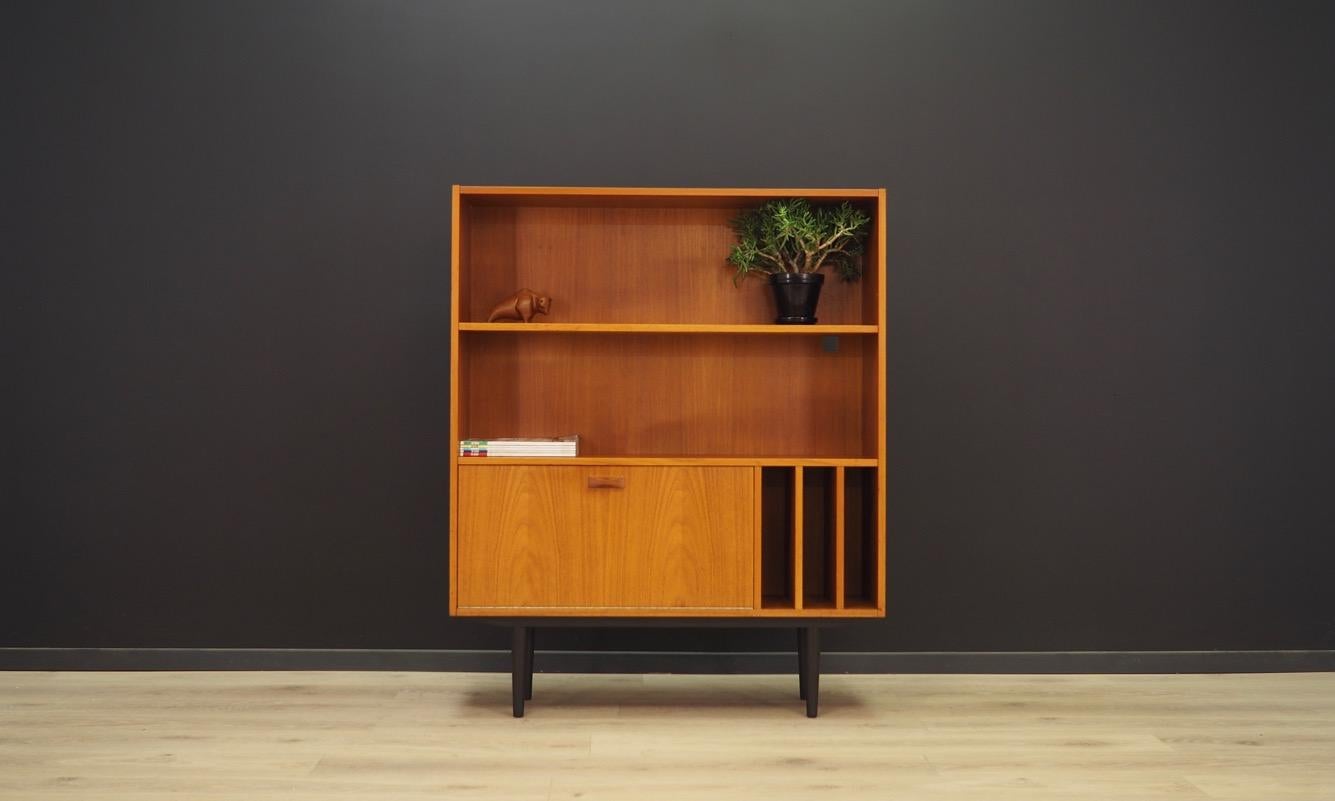 Classic bookcase - library from the 1960s-1970s, minimalistic form. Manufactured by Clausen & Son. The furniture finished with teak veneer. Shelf inside the bar. Maintained in good condition (minor bruises and scratches) - directly to