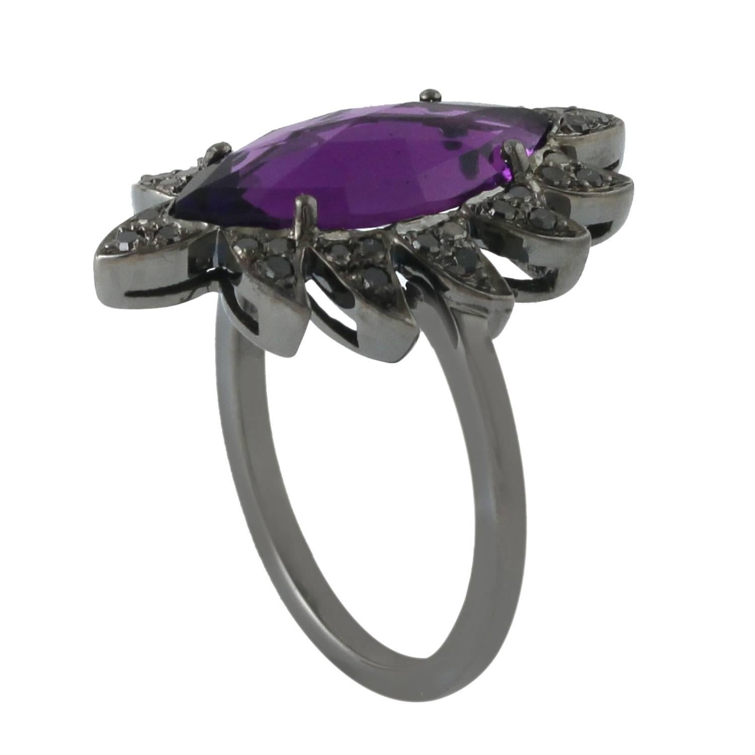 Cast in  18K gold & sterling silver.  This beautiful ring is hand set with 7.54 carat amethyst and 0.71 carat of black diamonds

18K 1.46 grams
Sterling Silver 4.17 grams
Black Diamond 0.71 carat
Amethyst 7.54 carat

FOLLOW  MEGHNA JEWELS storefront