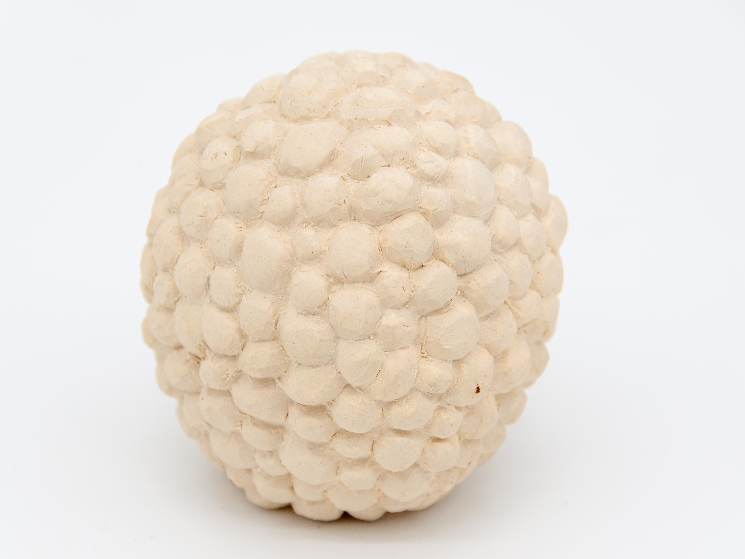 Isabel Halley a 21st-century ceramic artist based in Brooklyn, NY. She handcrafts all her designs making her signature bumpy style. This decorative bumpy object is unglazed.