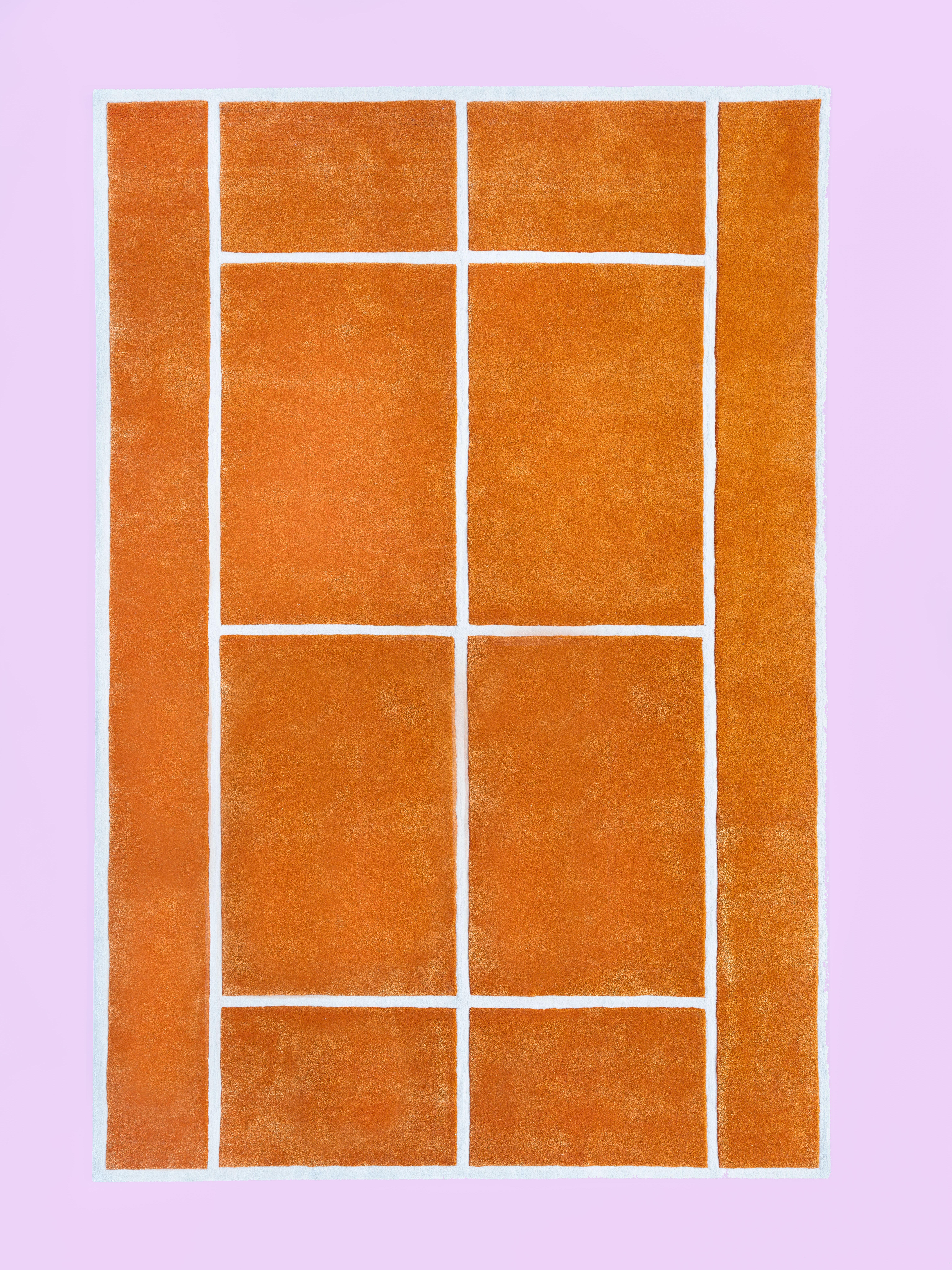 The “Court Series” rugs are hand tufted with blended wool and viscose material dyed in hyper-saturated colors, with tennis court-like geometries represented both via overlaid graphics as well as the cut and shape of individual segments.
Handmade in