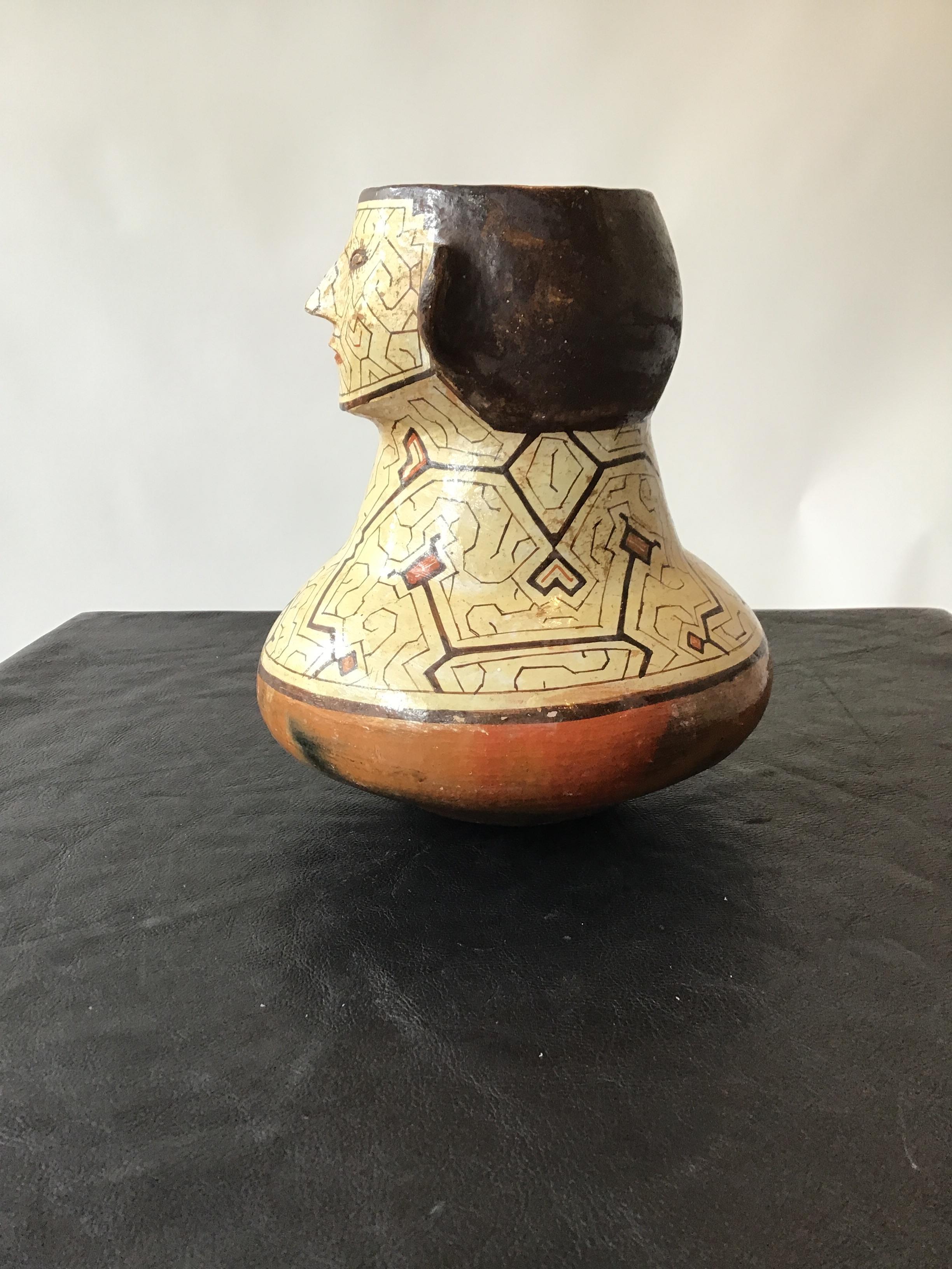 Mid-20th Century Shipibo Peruvian Clay Face Vase For Sale
