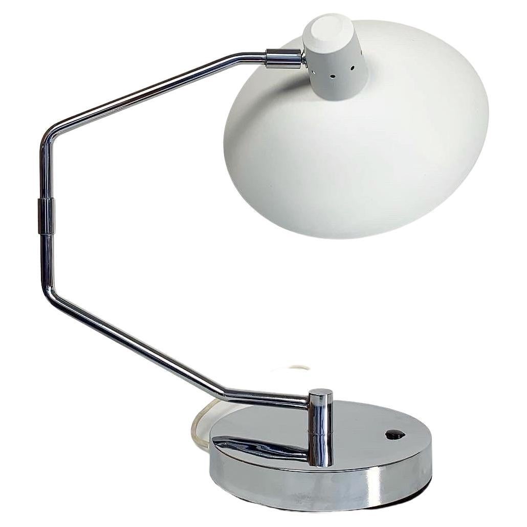 Desk lamp, model No. 4 designed by Clay Michie for Knoll International, designed in the 1950s.

Made of chromed steel with a matte white lacquered shade. Adjustable arm and shade. Heavy base for a solid stand.