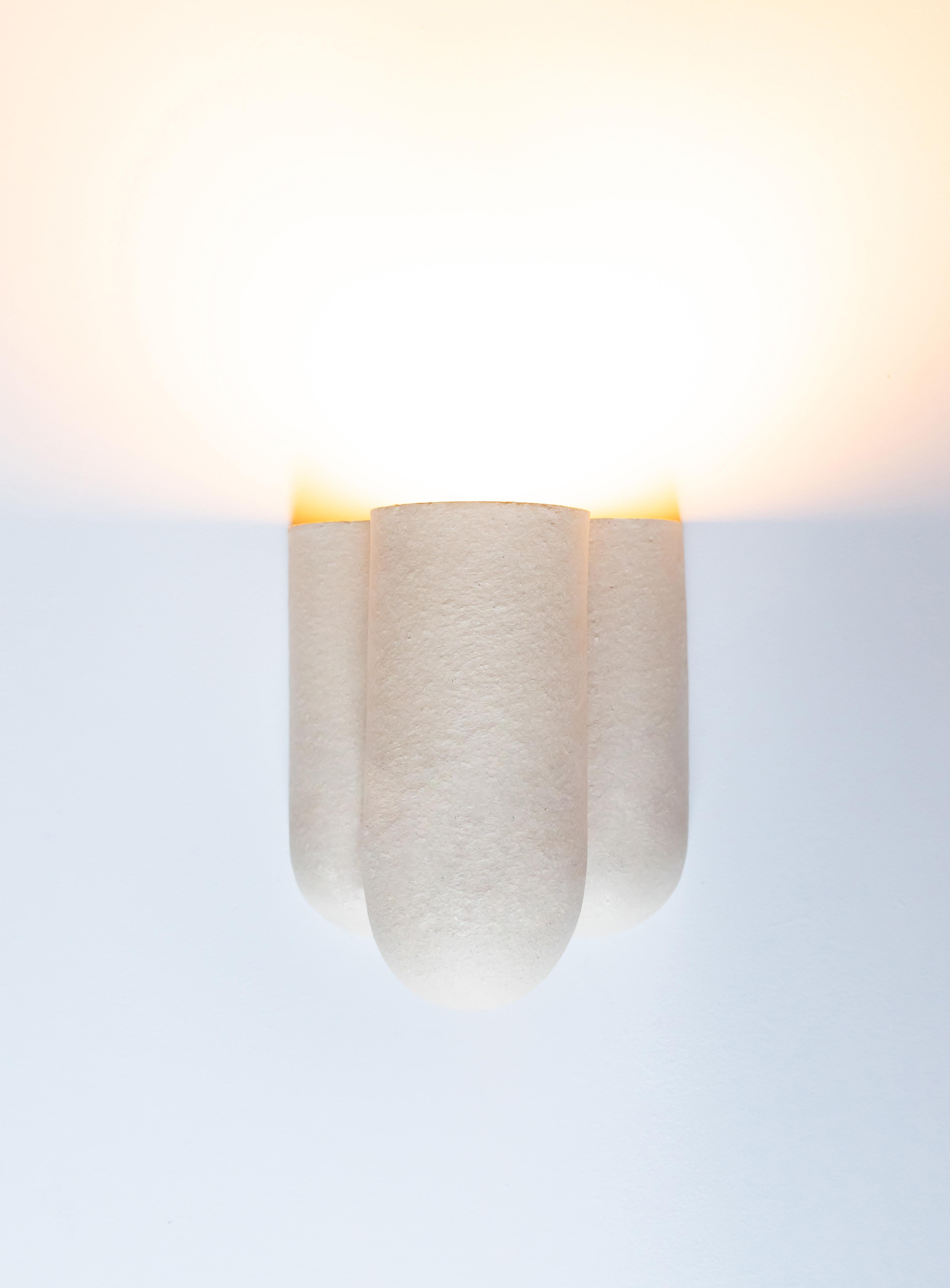 Wall light by Lisa Allegra
Dimensions: W 24 x D 17 x H 22,5 cm
Materials: Clay
Variations available.

Born in 1986 in Paris, Lisa Allegra has earned in 2010 a degree in furniture design from the École Supérieure des Arts Décoratifs. She has