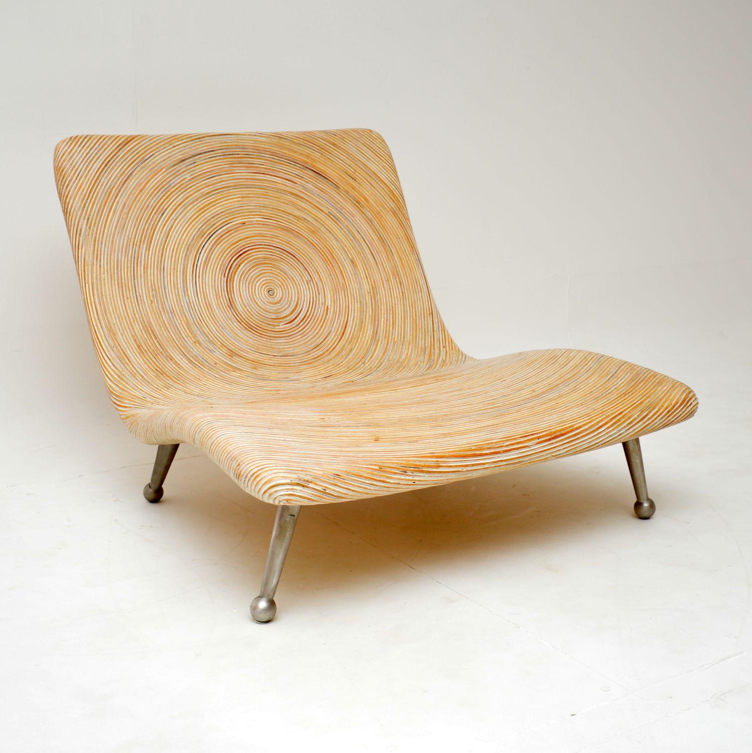 This striking and beautiful design is called the ‘coconut’ chair. It was designed by the famous Filipino designer Clayton Tugonon for Snug, and was made in the early 21st century.

This is a stylish and very eco friendly design, made from salvaged