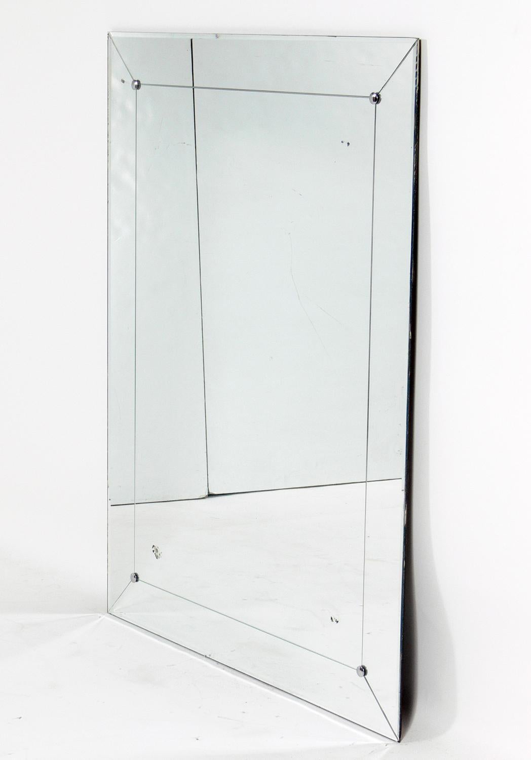 Clean lined Art Deco mirror, American, circa 1940s. Retains wonderful original patina with some age appropriate age spotting.