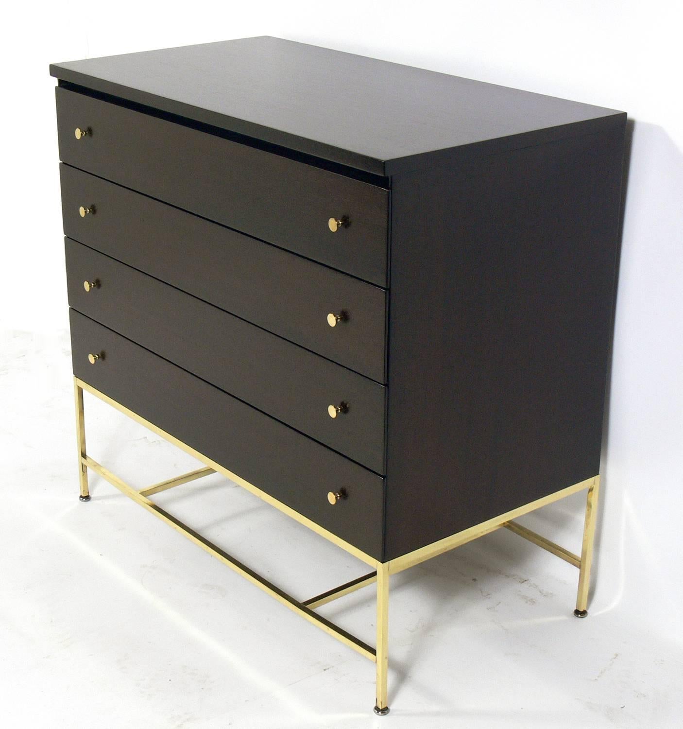 Clean lined chest with brass hardware designed by Paul McCobb.