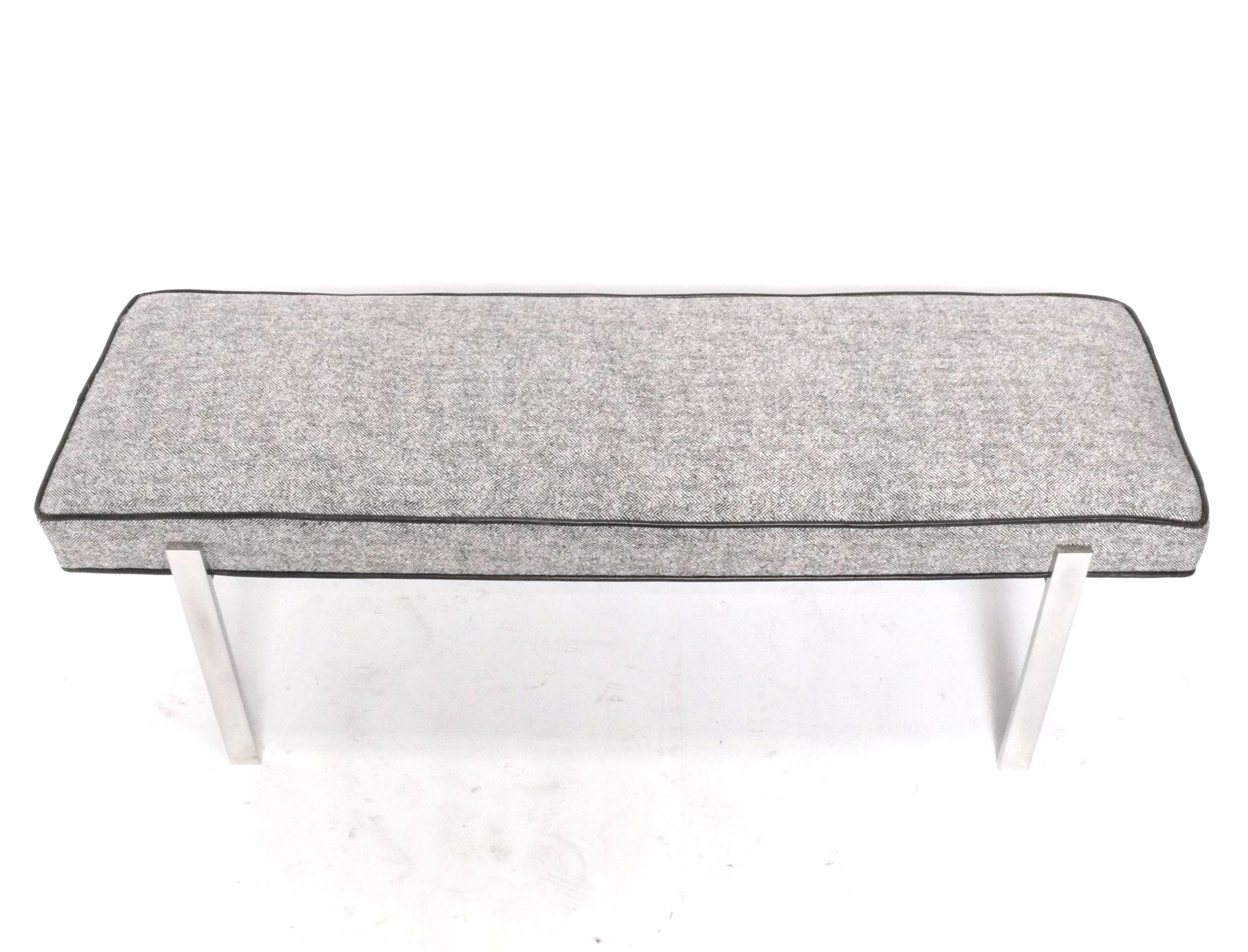 Clean Lined Chrome bench, circa 1980s. It has been recently reupholstered in a black and white herringbone fabric with black leather trim. High quality construction with heavyweight chrome frame, reminiscent of Laverne International or Knoll. 