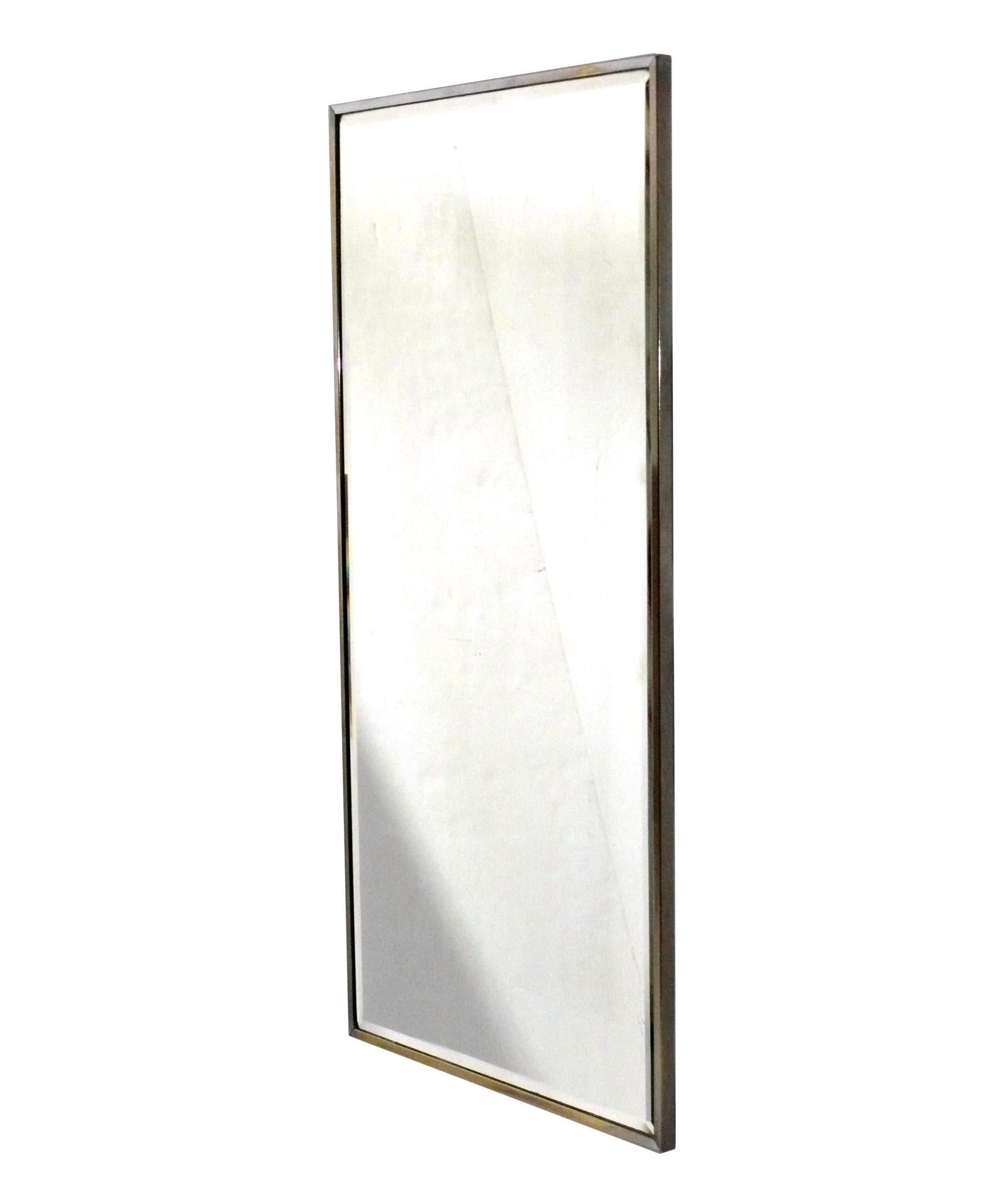 Clean Lined Chrome Mirror, American, circa 1950s. It measures 36.5