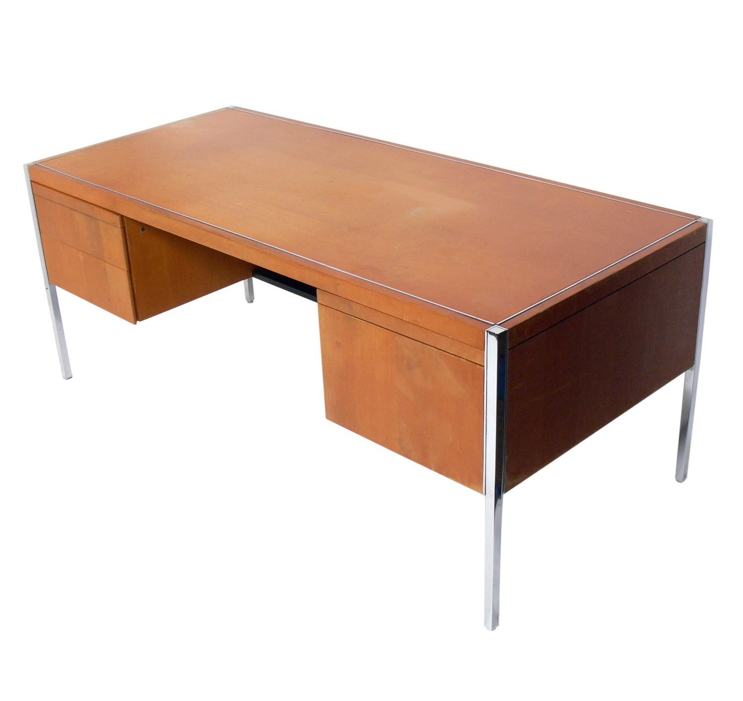 Clean lined executive desk, by Knoll, American, circa 1970s. Retains Knoll label underneath. This desk is currently being refinished and can be completed in your choice of color. The price noted below includes refinishing in your choice of color. It