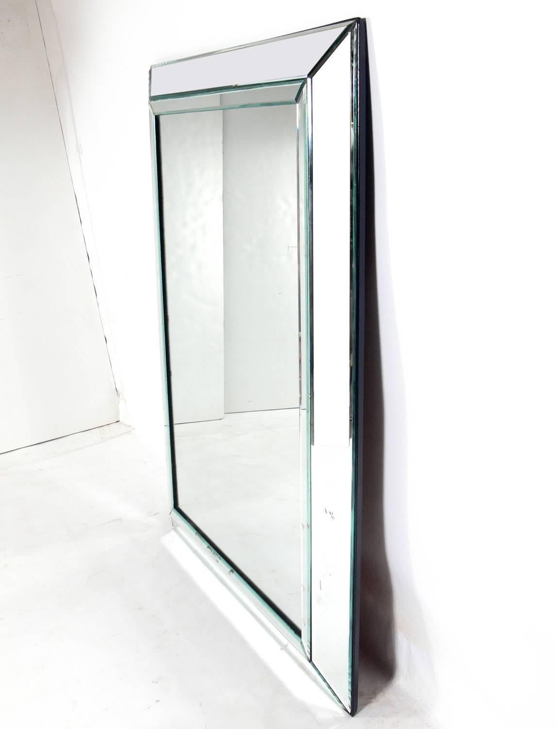 Clean lined large-scale mirror, American, circa 1950s. Retains warm original patina.