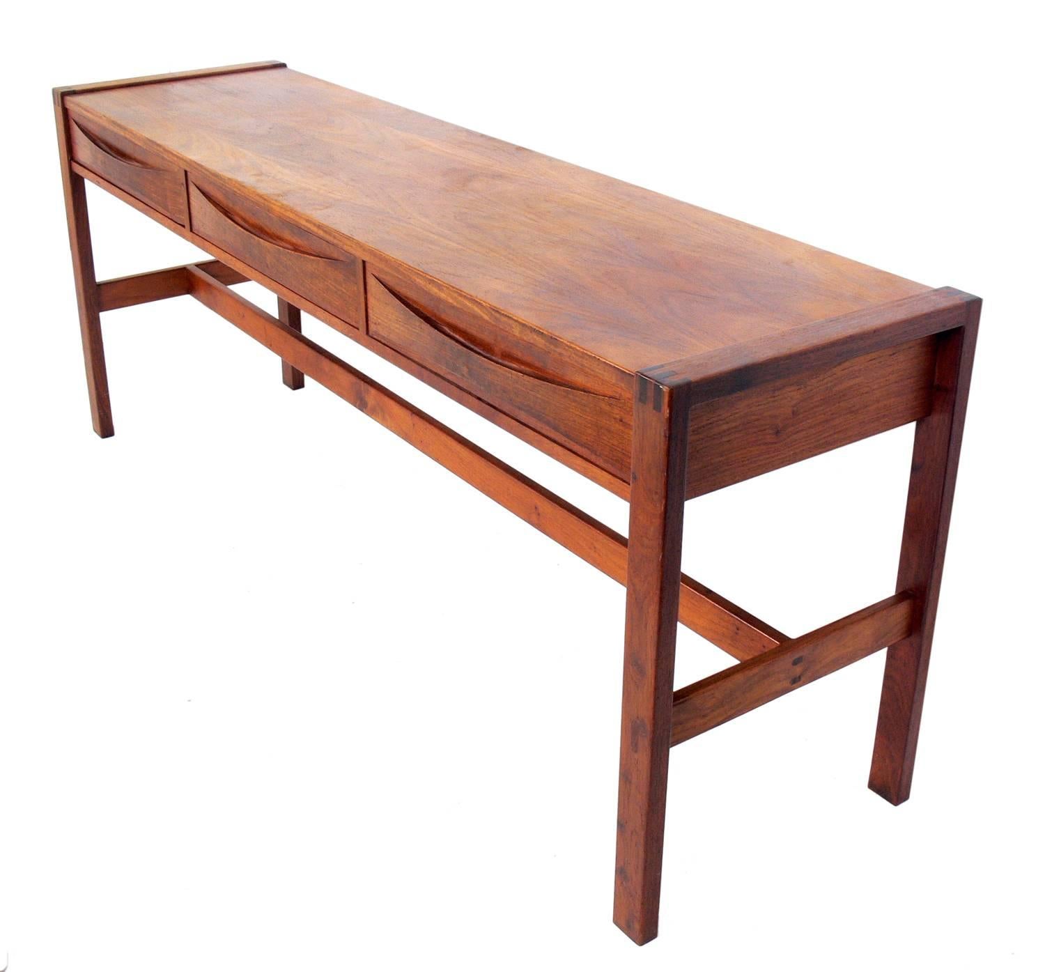 Clean lined midcentury console table, designed by John Tabraham for Kallenbach, South African, circa 1960s. Clearly inspired by Danish modern design, but with clean lines and little ornamentation, save the elegant joinery. See detail photos. This