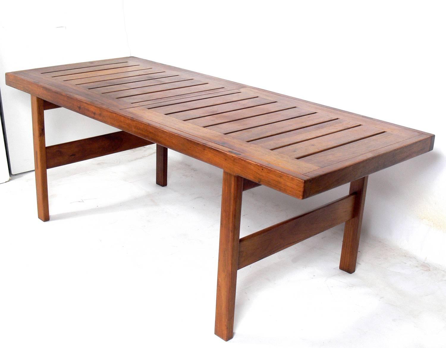 Clean lined midcentury dining table, designed by John Tabraham for Kallenbach, South African, circa 1960s. Retains wonderful original patina. Clearly inspired by Danish modern design, but with clean lines and little ornamentation, save for the