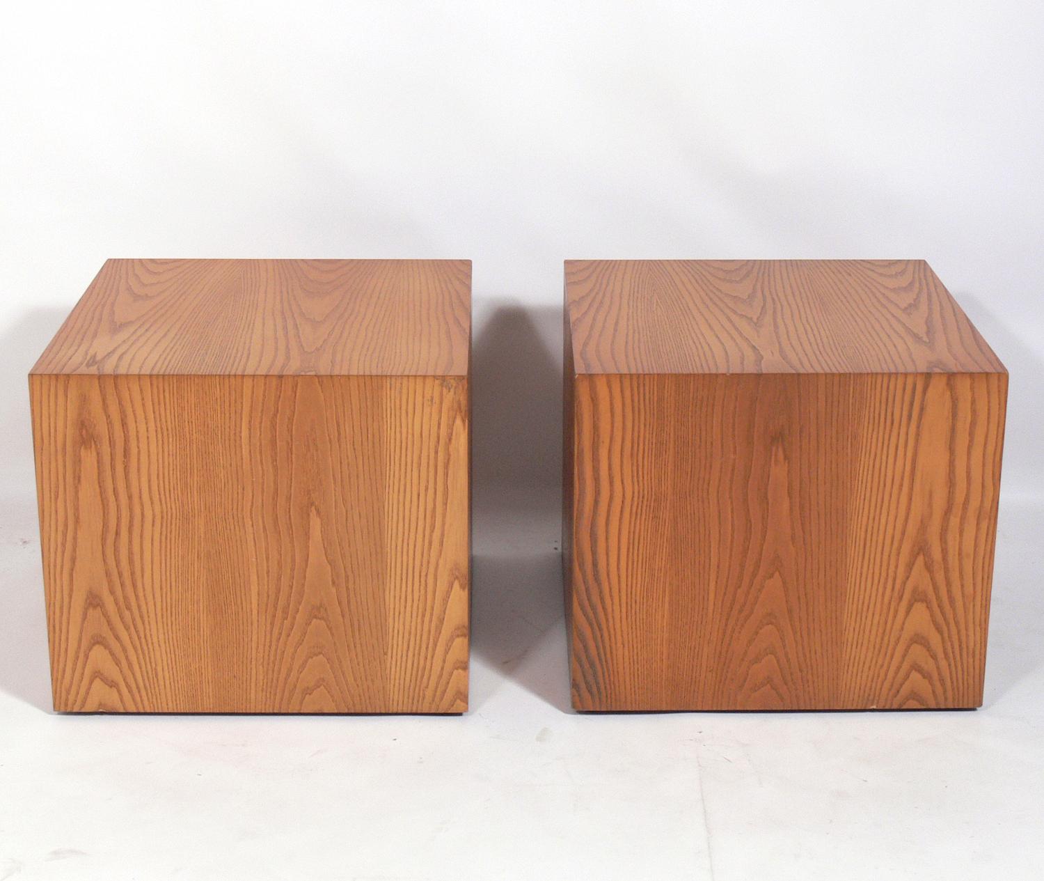 Clean lined oak cube tables, designed by Edward Axel Roffman, American, circa 1960s. They are a versatile size and can be used as end or side tables, or as night stands or pedestals for artwork. They retain their warm original patina.