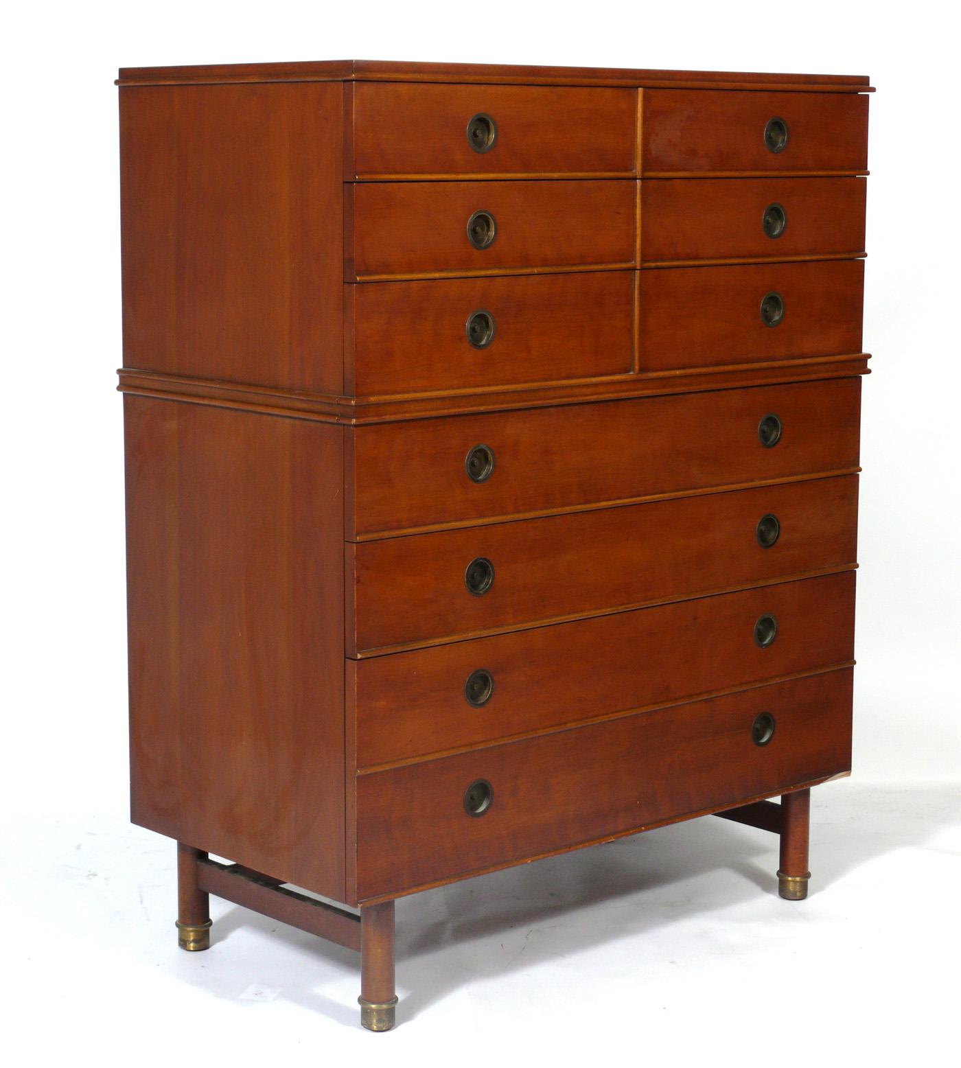 Clean lined midcentury tall chest or dresser, designed by Renzo Rutili for Johnson Furniture, American, circa 1950s. It is a versatile size and can be used as a chest or dresser in a bedroom, or as a bar or media cabinet in a living area. It is