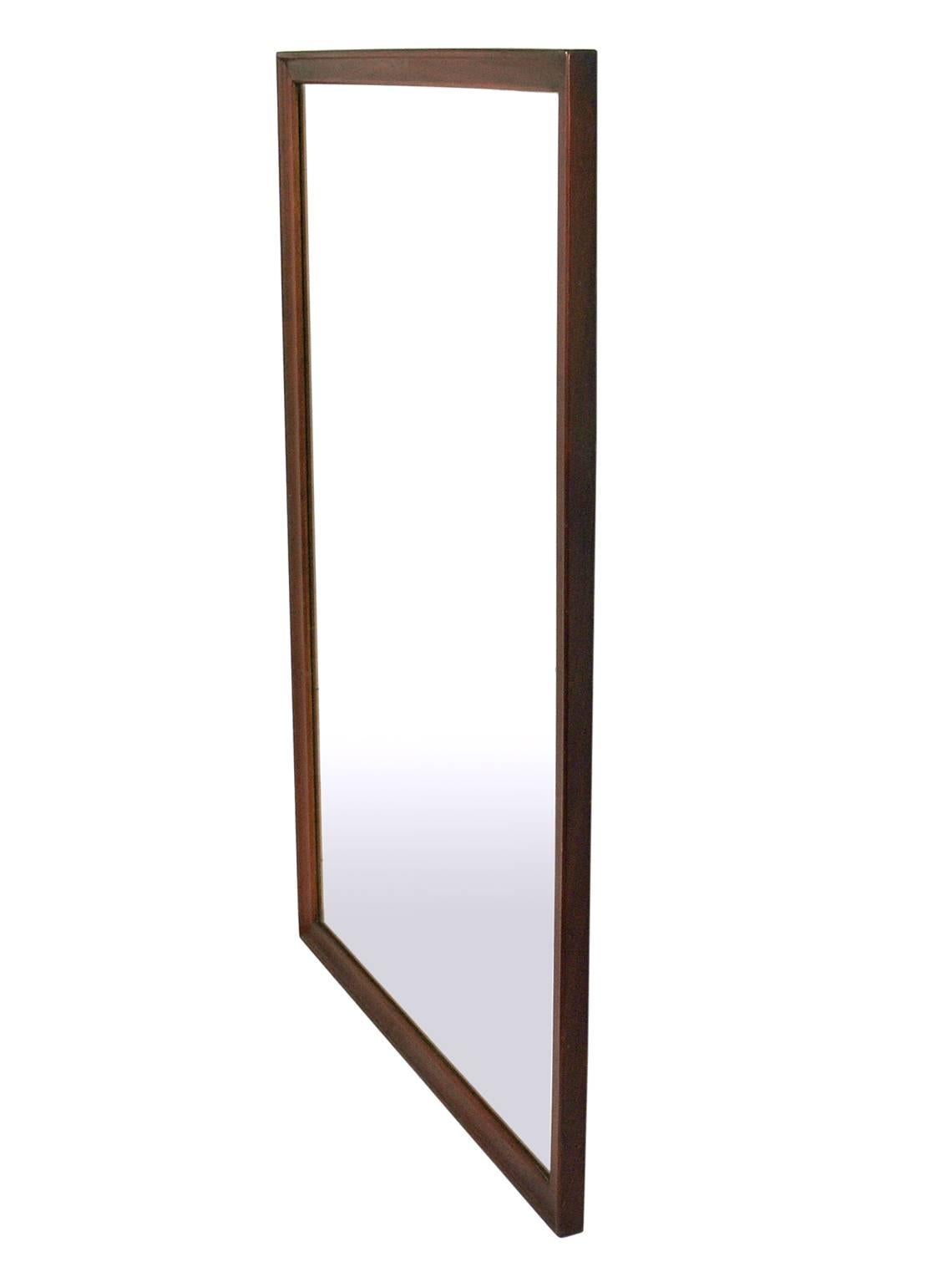 Clean lined walnut mirror by Kipp Stewart for Drexel, American, circa 1950s. Retains it's warm original patina. Has been cleaned and Danish oiled. Can be hung vertically or horizontally, just let us know which you prefer.