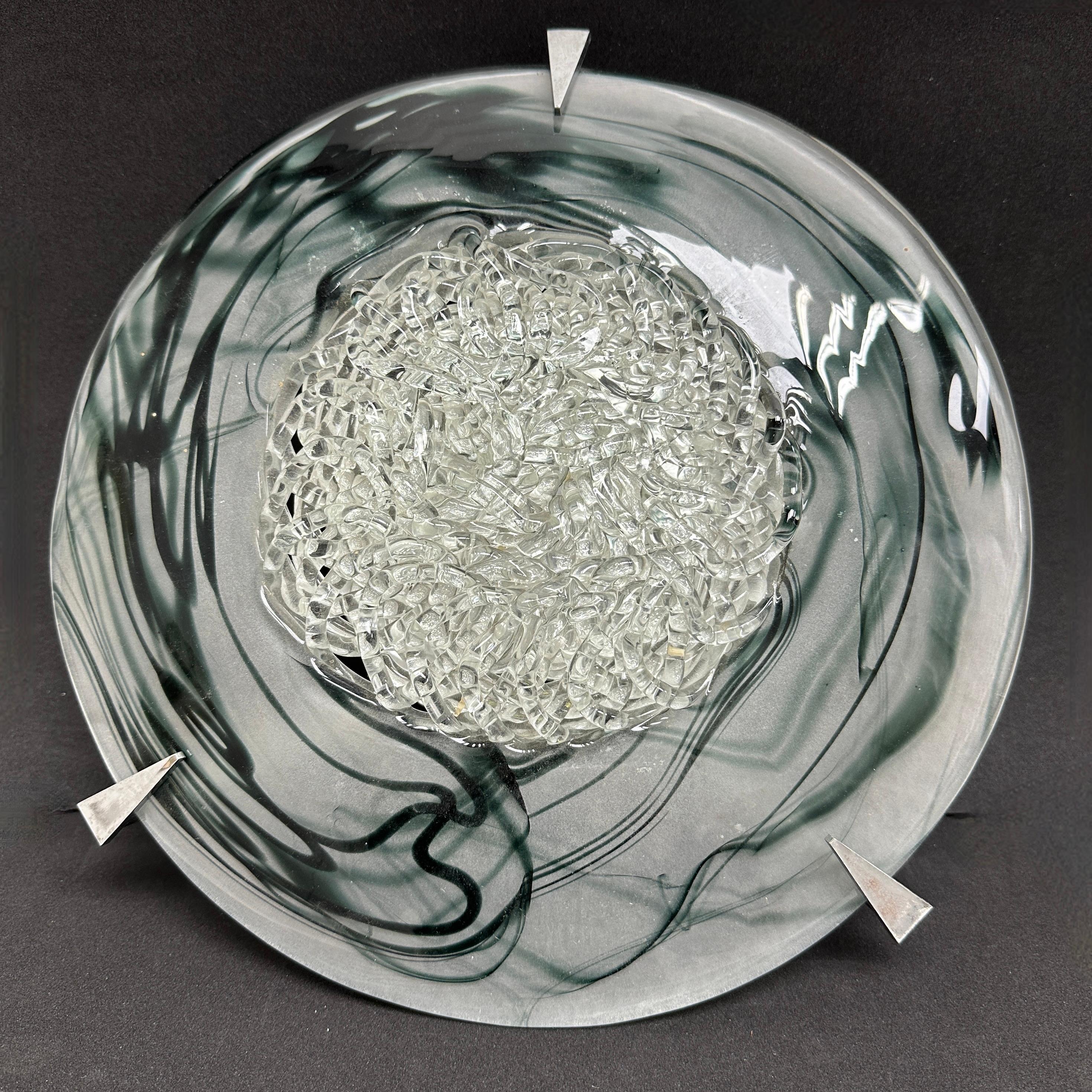 A beautiful Murano glass flush mount or wall light. Made in Italy in the 1980s. Gorgeous textured glass flush mount with metal fixture.The Fixture requires 0 European E14 / 110 Volt Candelabra bulbs, each bulb up to 60 watts. A nice addition to any