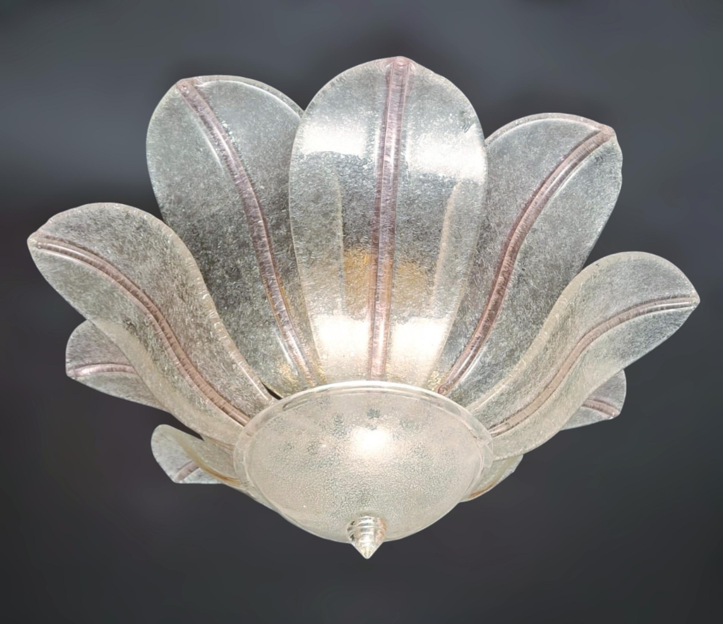 Vintage Italian Murano glass flush mount with clear graniglia glass leaves decorated with a pink line in the center on each leaf / Made in Italy in the style of Barovier e Toso, circa 1960s
Measures: Diameter 31.5 inches, height 14 inches
6 lights /