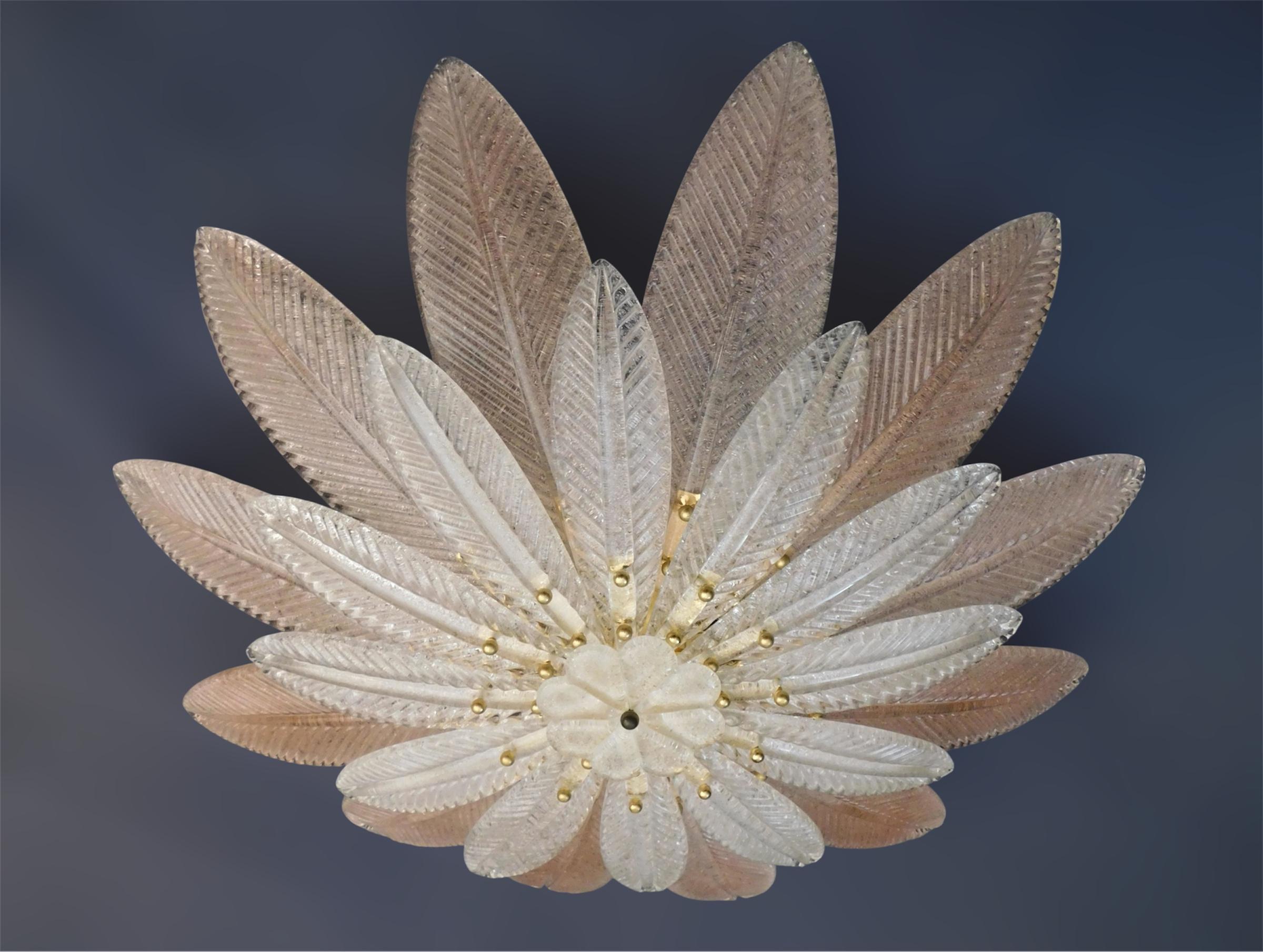 Vintage Italian Murano glass flush mount with clear and pink graniglia glass leaves mounted on gold finish metal frame / Made in Italy in the style of Barovier e Toso, circa 1960s
Measures: Diameter 31.5 inches, height 7 inches
6 lights / E12 or E14