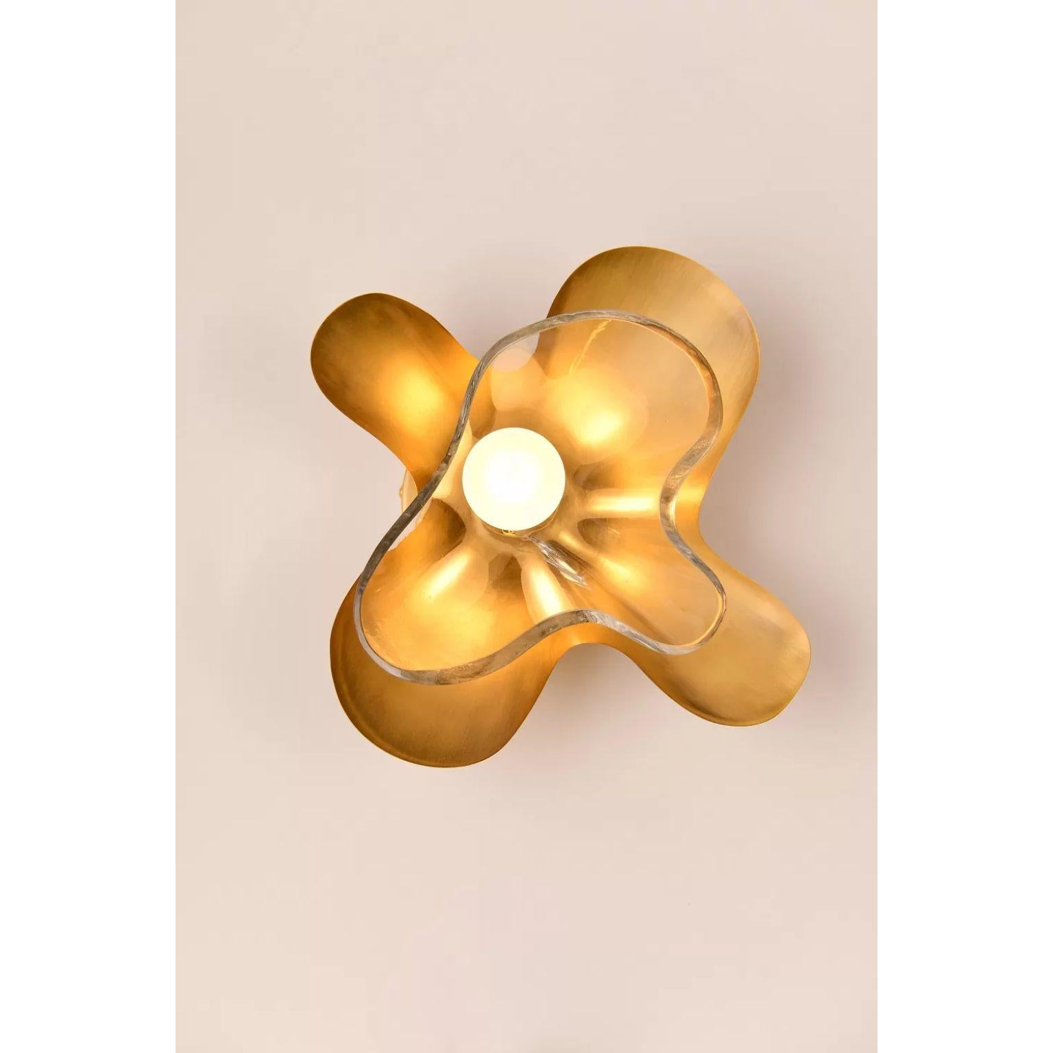 Clear Butterfly Wall Sconce by Dainte
Dimensions: D 13.5 x W 28.5 x H 28 cm.
Materials: Glass and brass. 

The Butterfly wall sconce features an elegant silhouette modeled after the wings of a butterfly in motion. Layered textured brass and glass, a