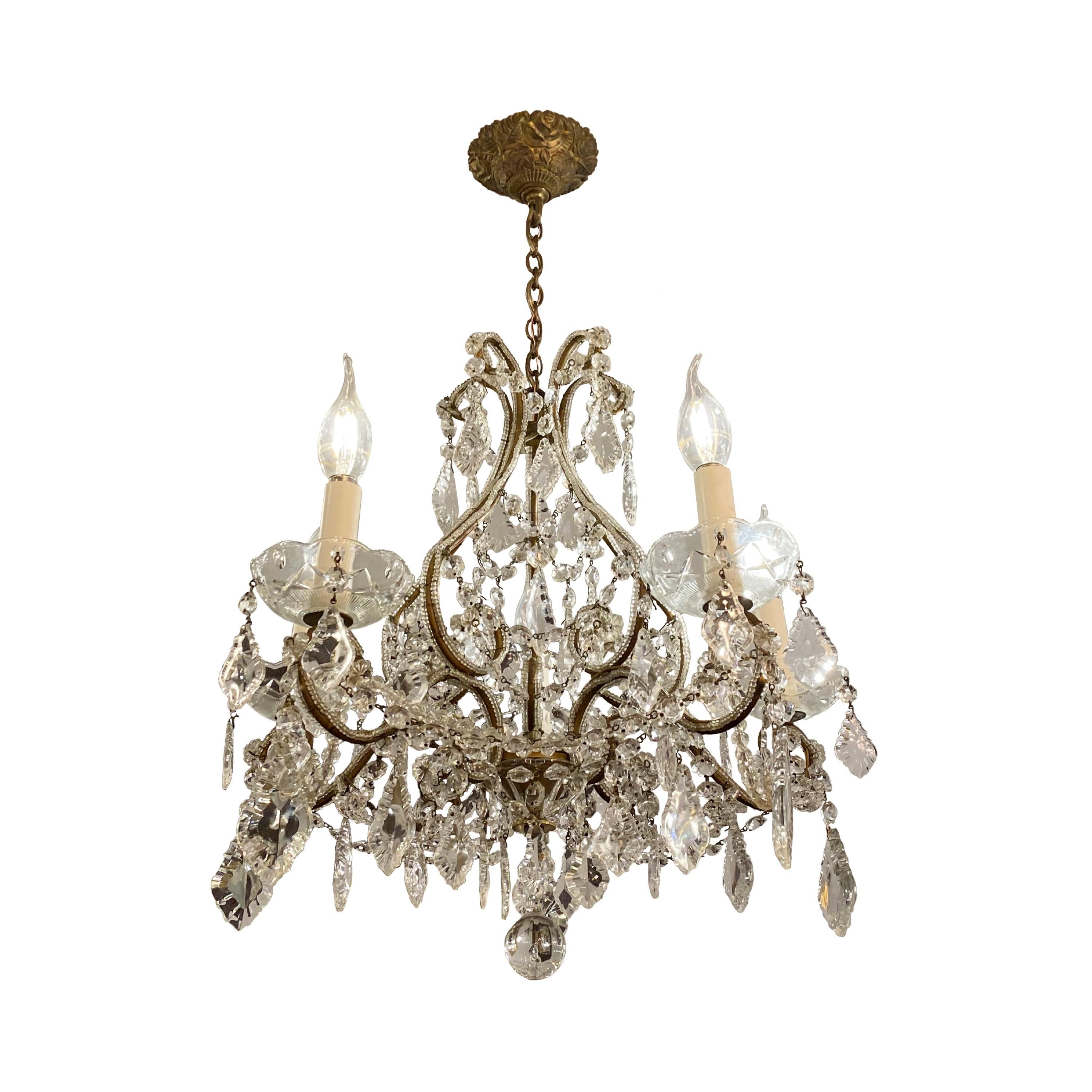 20th century Petite clear crystal chandelier with five beaded brass arms and matching ornate canopy. Takes five standard candelabra lightbulbs. Cleaned and restored. Please note, this item is located in one of our NYC locations.