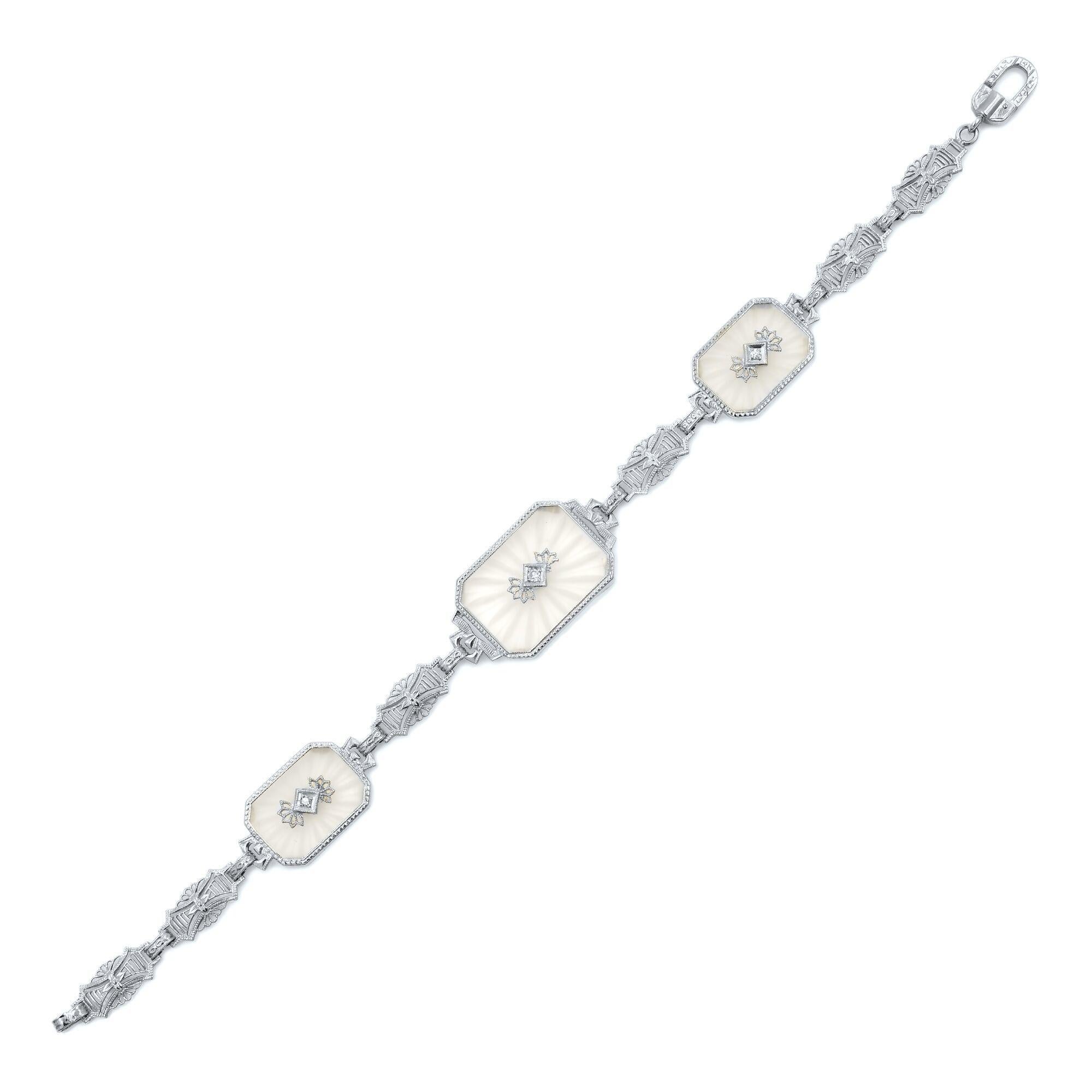 This gorgeous pendant necklace and bracelet set is crafted in 14k white gold and encrusted with 4 round cut diamonds and clear crystals. Chain length: 16 Inches. Pendant size: 38mm. Bracelet length: 7.5 Inches. Total weight 13.6 gms. The bracelet