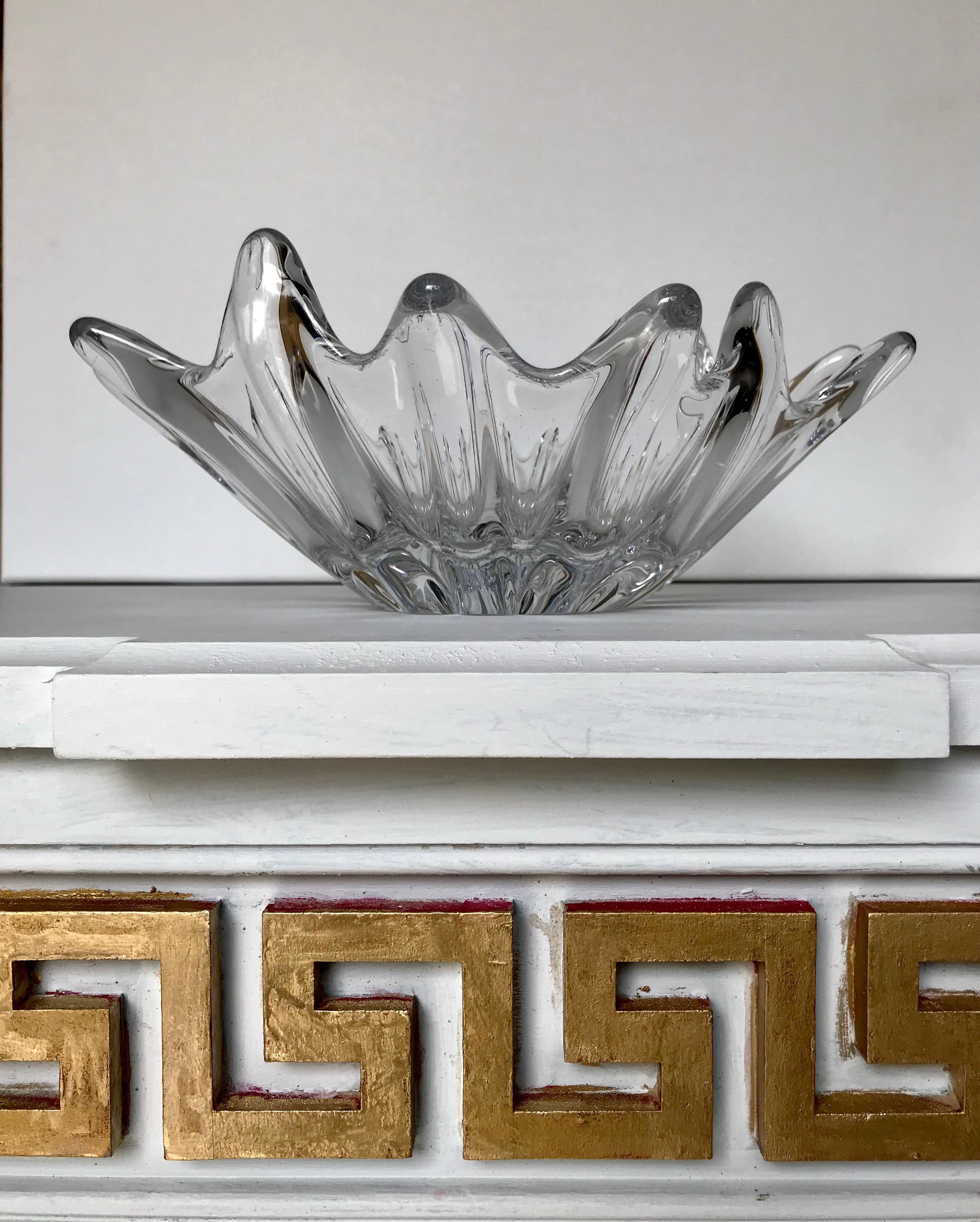 A sculptural and modern leaded glass bowl by Daum, one of the most illustrious glass makers of the 20th century in Nancy, France, circa 1950. Daum was awarded a Grand Prix during the 1900, Universal Exhibition for their exquisite glass pieces. The