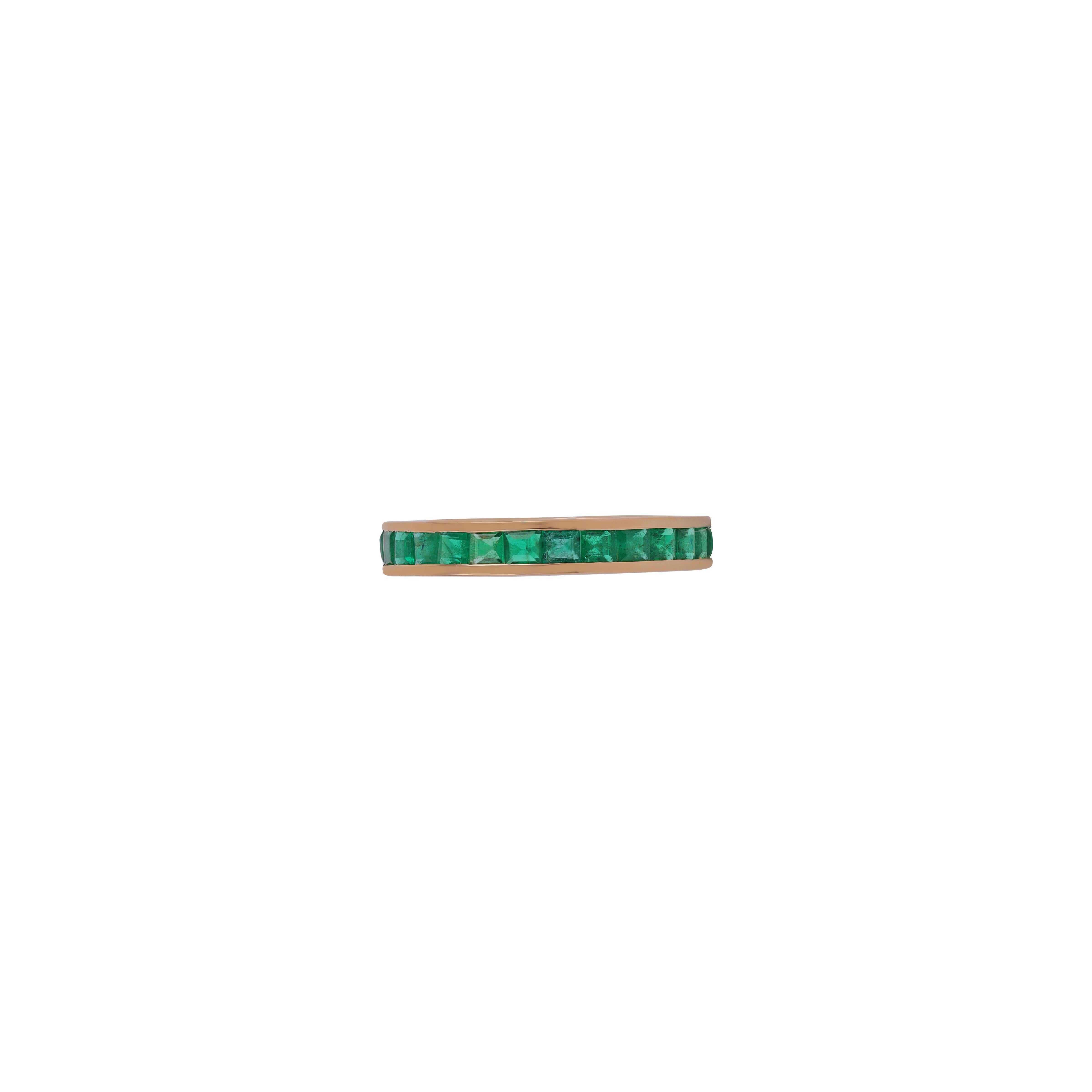 18 karat gold channel set emerald step cut band ring.

This beautiful linear band ring with lustrous emeralds . Elegance and chic in one, this ring features good quality square shaped step cut emeralds channel set in a linear pattern. Wear it day in