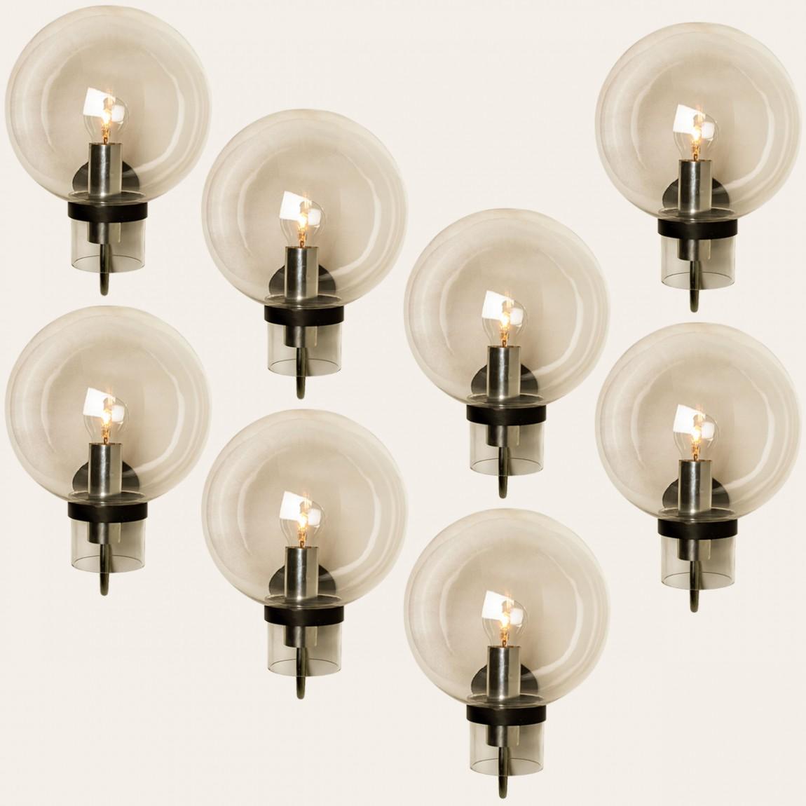 Large quantity of beautiful hand blown clear glass wall lights designed and manufactured by Glashütte Limburg, Germany around 1975.

Beautiful craftsmanship. These midcentury vintage lights feature handmade, elaborate clear bubble glass with a