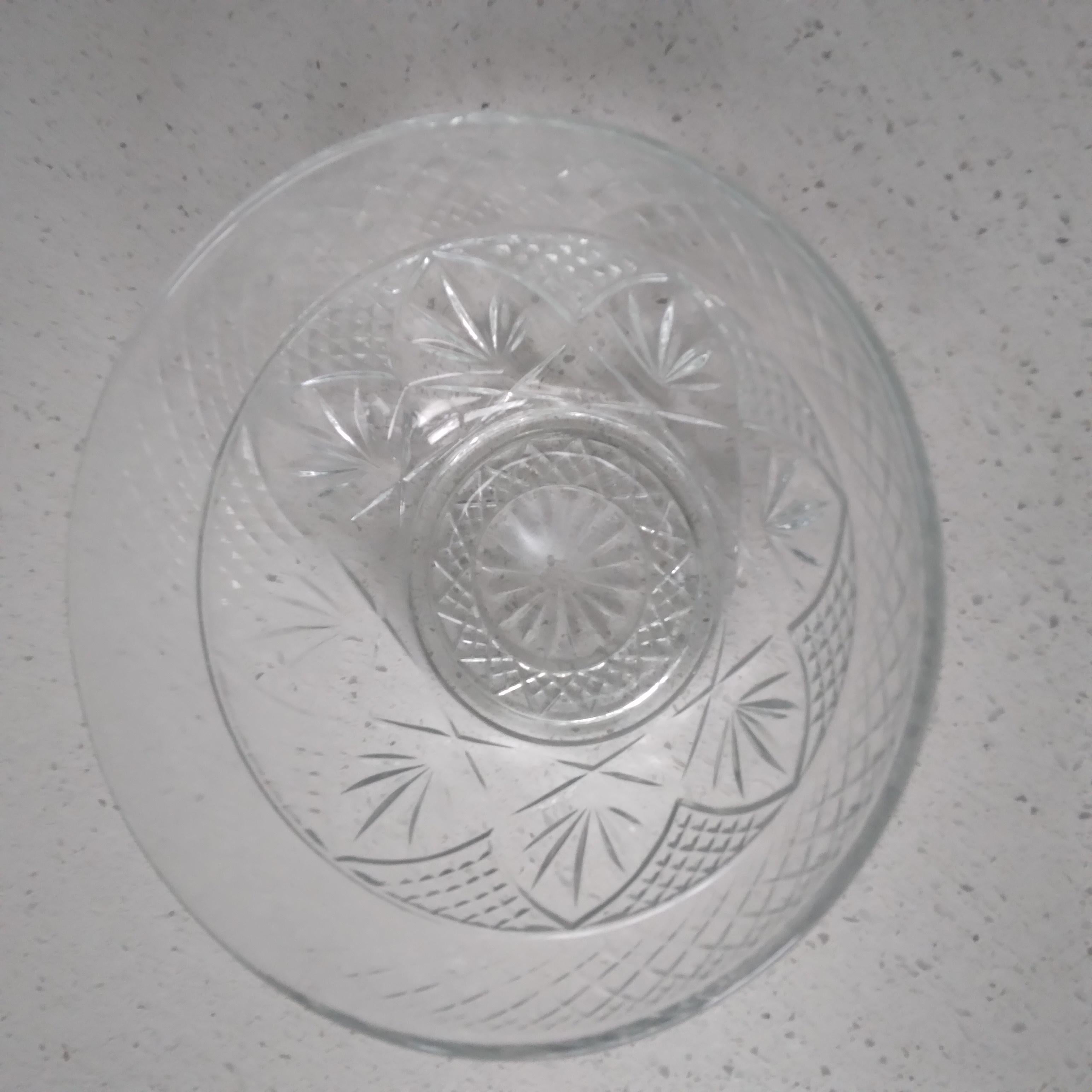 Beautifully translucent, this vintage glass bowl is ready to add light and artistry to your decor. We love intricate fan and diamond motif! In excellent condition.