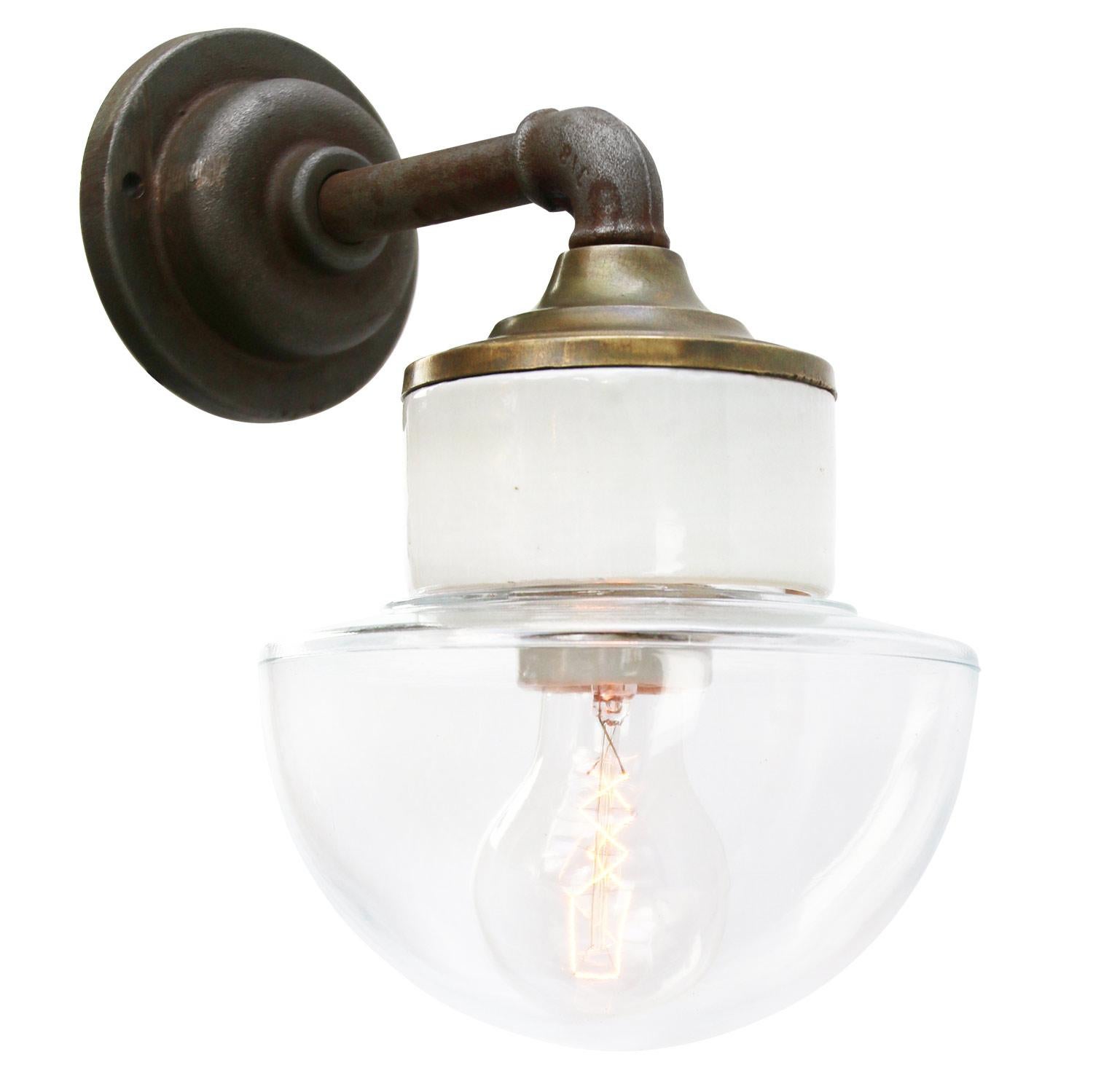 Porcelain Industrial wall lamp.
White porcelain, brass and cast iron
Clear glass.
2 conductors, no ground.

Diameter wall mount 10.5 cm / 4”.
2 holes to secure.

For use inside only

Weight: 2.05 kg / 4.5 lb

Priced per individual item. All lamps