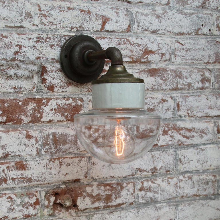 Clear Glass Brass Vintage Cast Iron Arm Scones Wall Lights In Good Condition For Sale In Amsterdam, NL