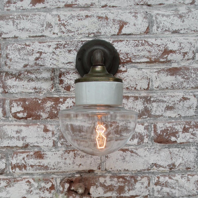 20th Century Clear Glass Brass Vintage Cast Iron Arm Scones Wall Lights For Sale
