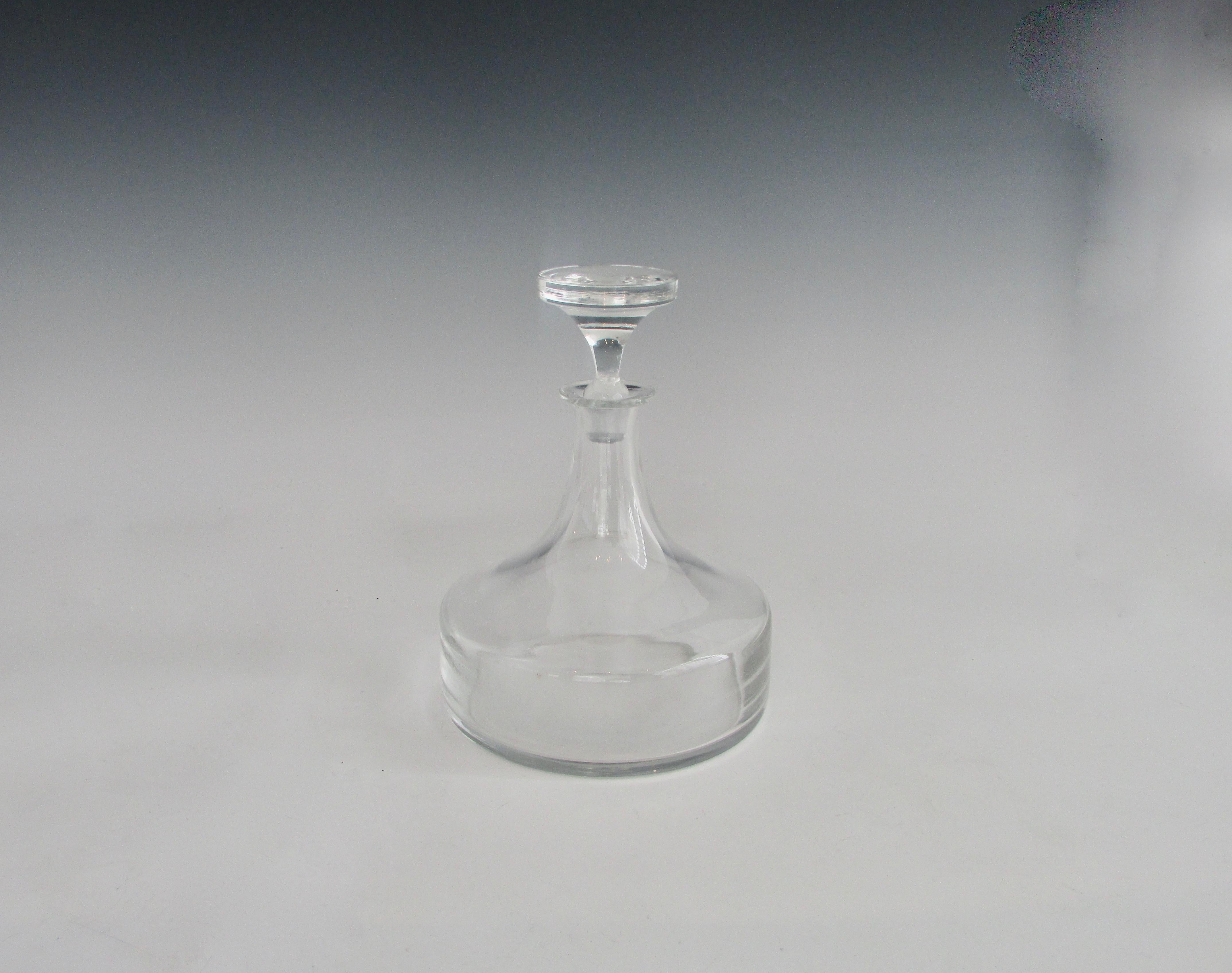 Elegant clear glass decanter with original stopper. 6.5