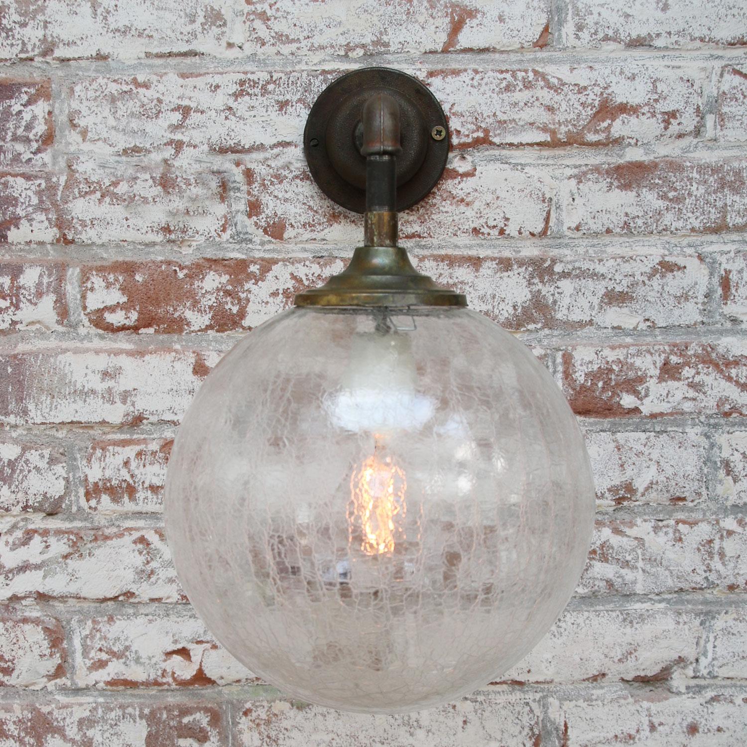 Brass and cast iron industrial wall light
clear texture glass globe

Diameter cast iron wall piece: 10.5 cm / 4”, 2 holes to secure

Weight: 2.30 kg / 5.1 lb

Priced per individual item. All lamps have been made suitable by international standards