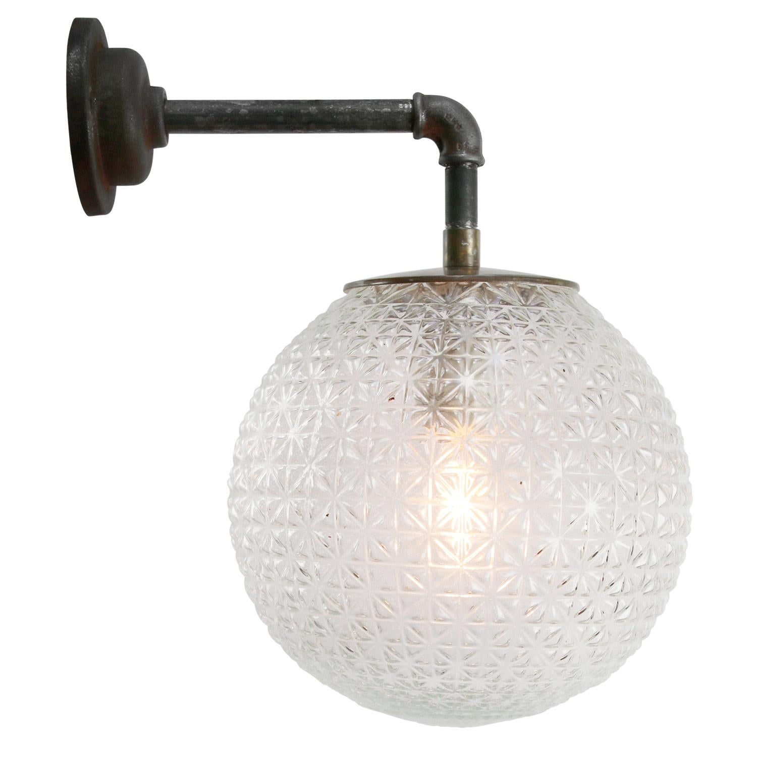Brass and cast iron industrial wall light
Clear texture glass globe

Diameter cast iron wall piece: 10.5 cm / 4” cm, 2 holes to secure

Weight: 4.80 kg / 10.6 lb

Priced per individual item. All lamps have been made suitable by international