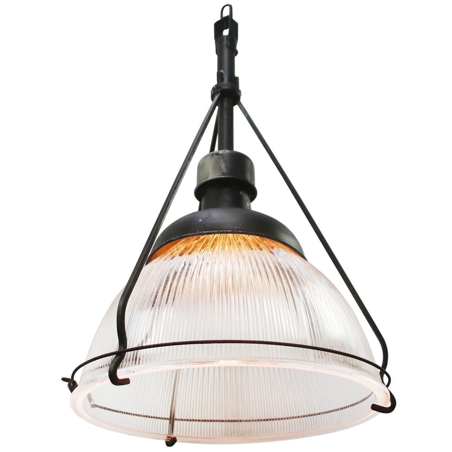 Glass lamp by Holophane, USA.
Iron top. Porcelain bulb holder.
2 meter black wire.

Weight: 8.50 kg / 18.7 lb

Priced per individual item. All lamps have been made suitable by international standards for incandescent light bulbs, energy-efficient