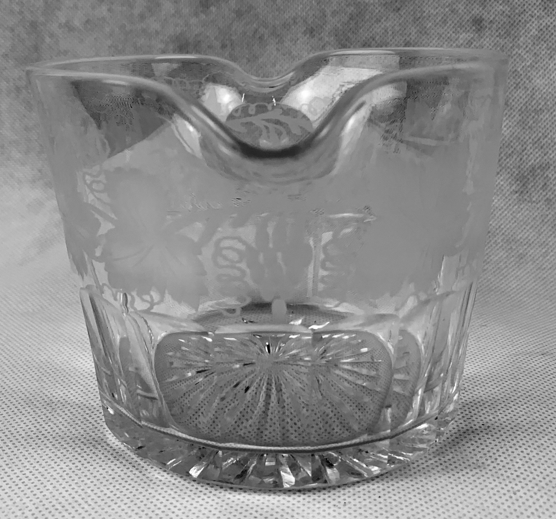 Victorian engraved and cut glass double lipped hand blown wine rinser with a pattern of grapes and leaves. The bottom half of this piece has thumb cut panels or slice cut panels while the bottom is star cut. Today these are quite often used for
