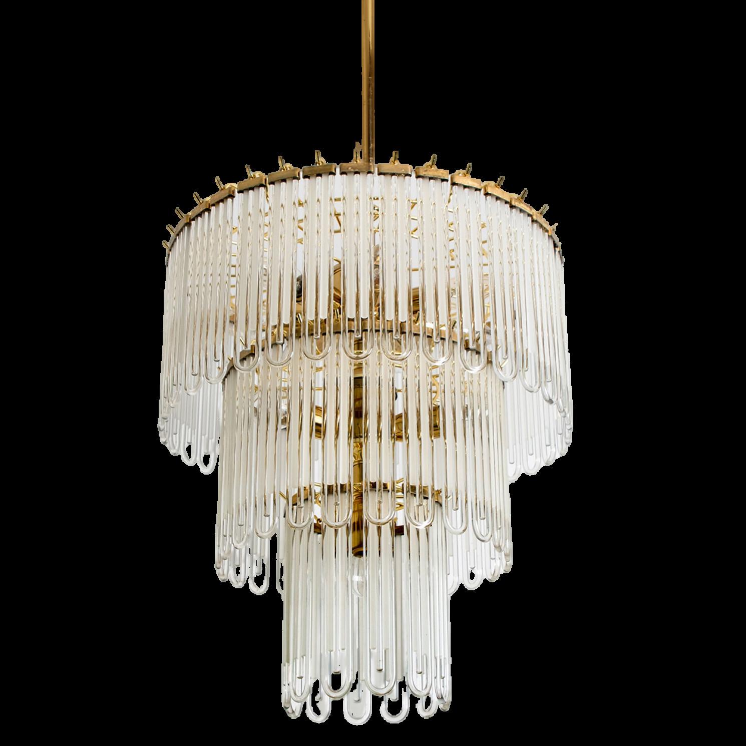 Clean lines to complement all decors. Wonderful high-end light fixture by Sciolari. With brass detail hanging glass giving the piece an elegant appearance which refracts the light, filling a room with a soft, warm glow

The chandelier has brass