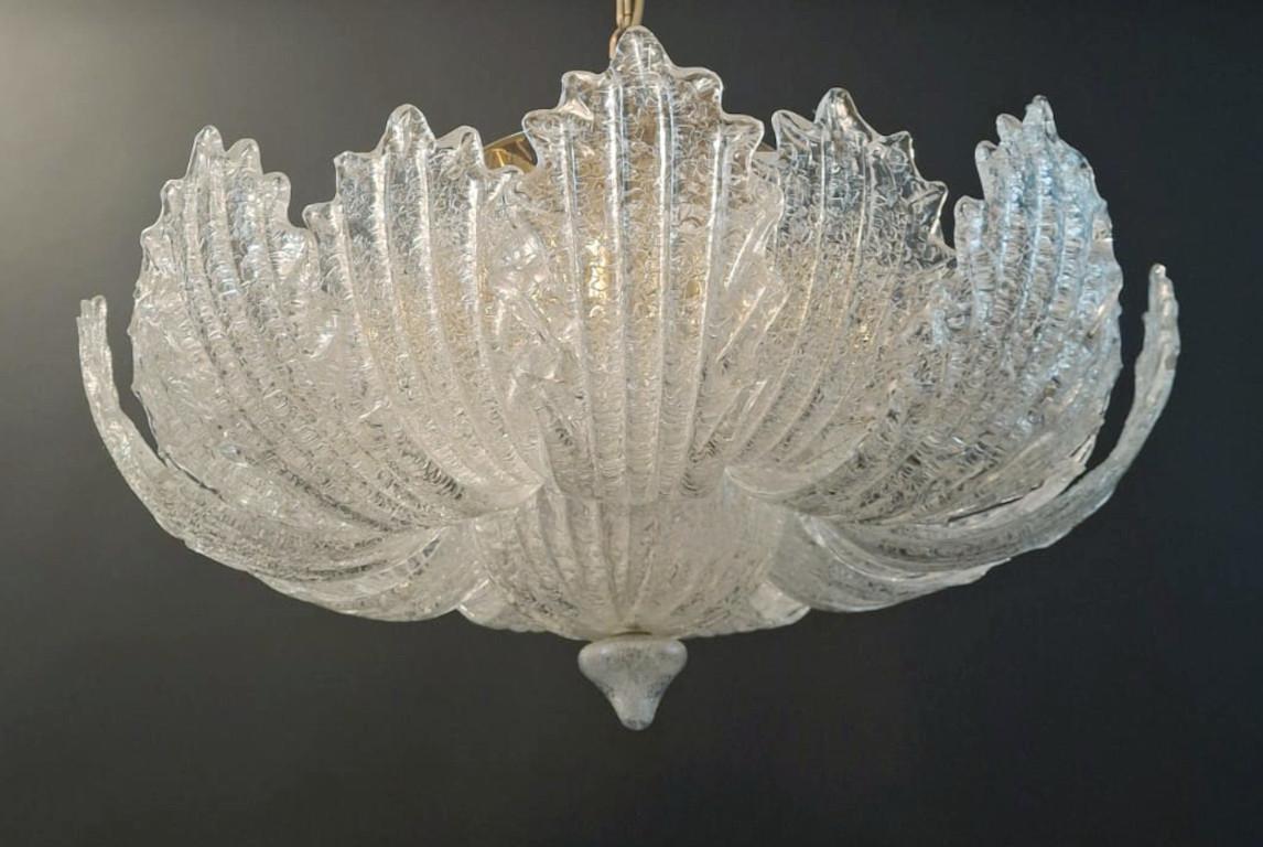 Vintage Italian Murano glass flush mount with clear graniglia glass leaves mounted on gold metal frame / Made in Italy in the style of Barovier e Toso, circa 1960s
11 lights / E12 or E14 type / max 40W each
Measures: Diameter 25.5 inches, height 14
